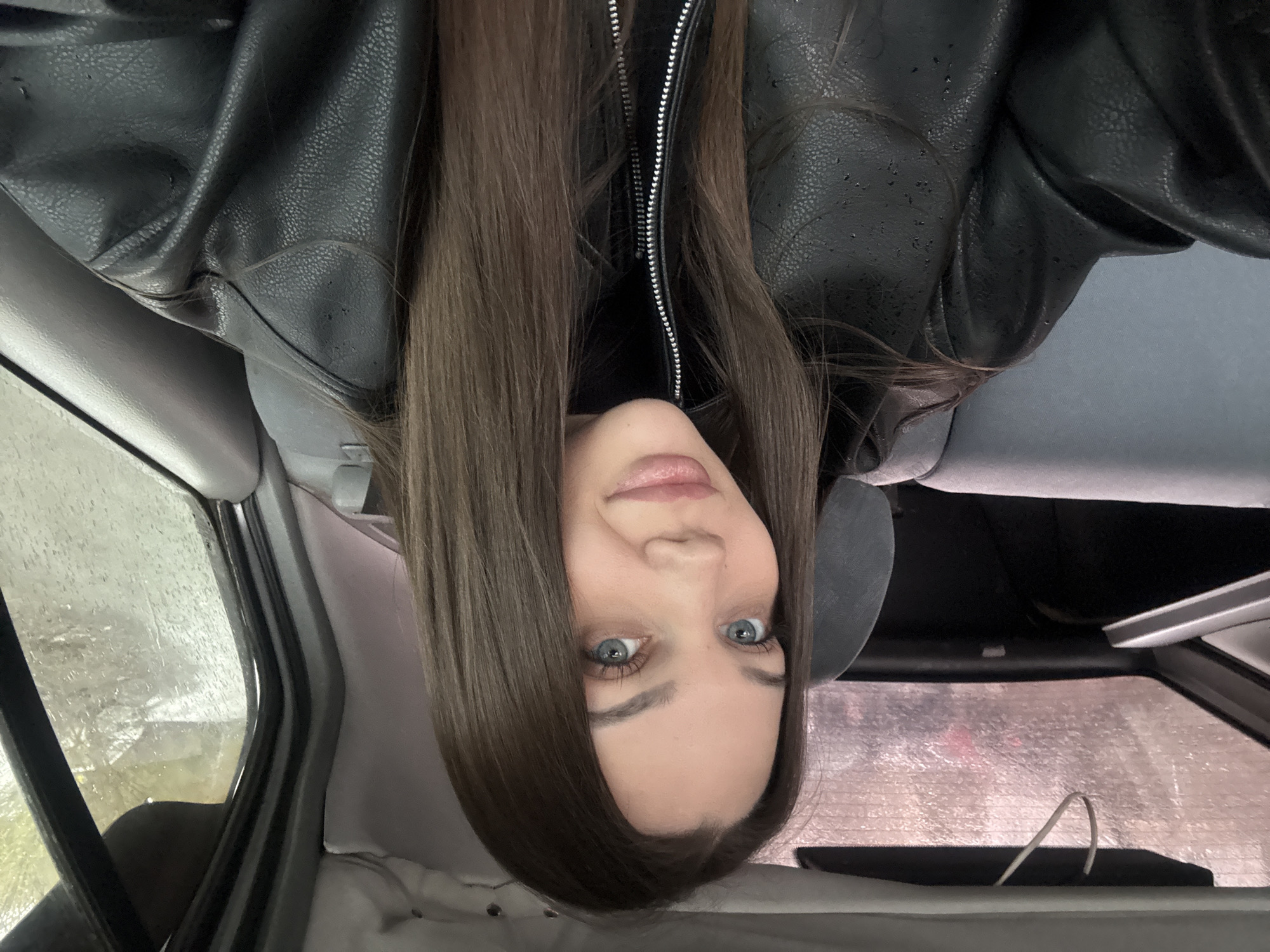 Woman in black jacket observed in stationary car, Yekaterinburg