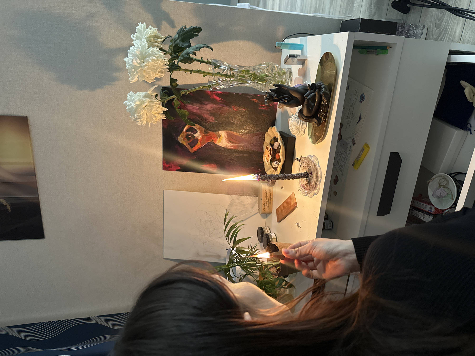 Woman observed in candlelit indoor setting in Murino, Russia