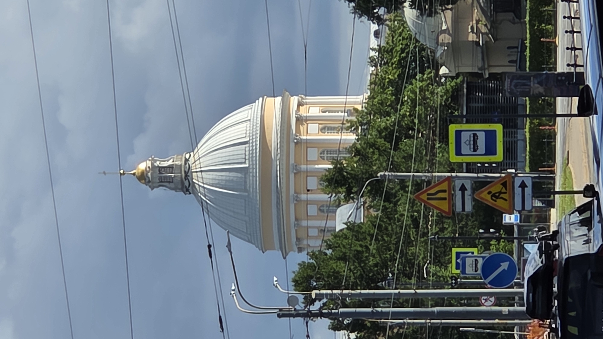 Golden dome and cross of a Saint Petersburg cathedral, up close.