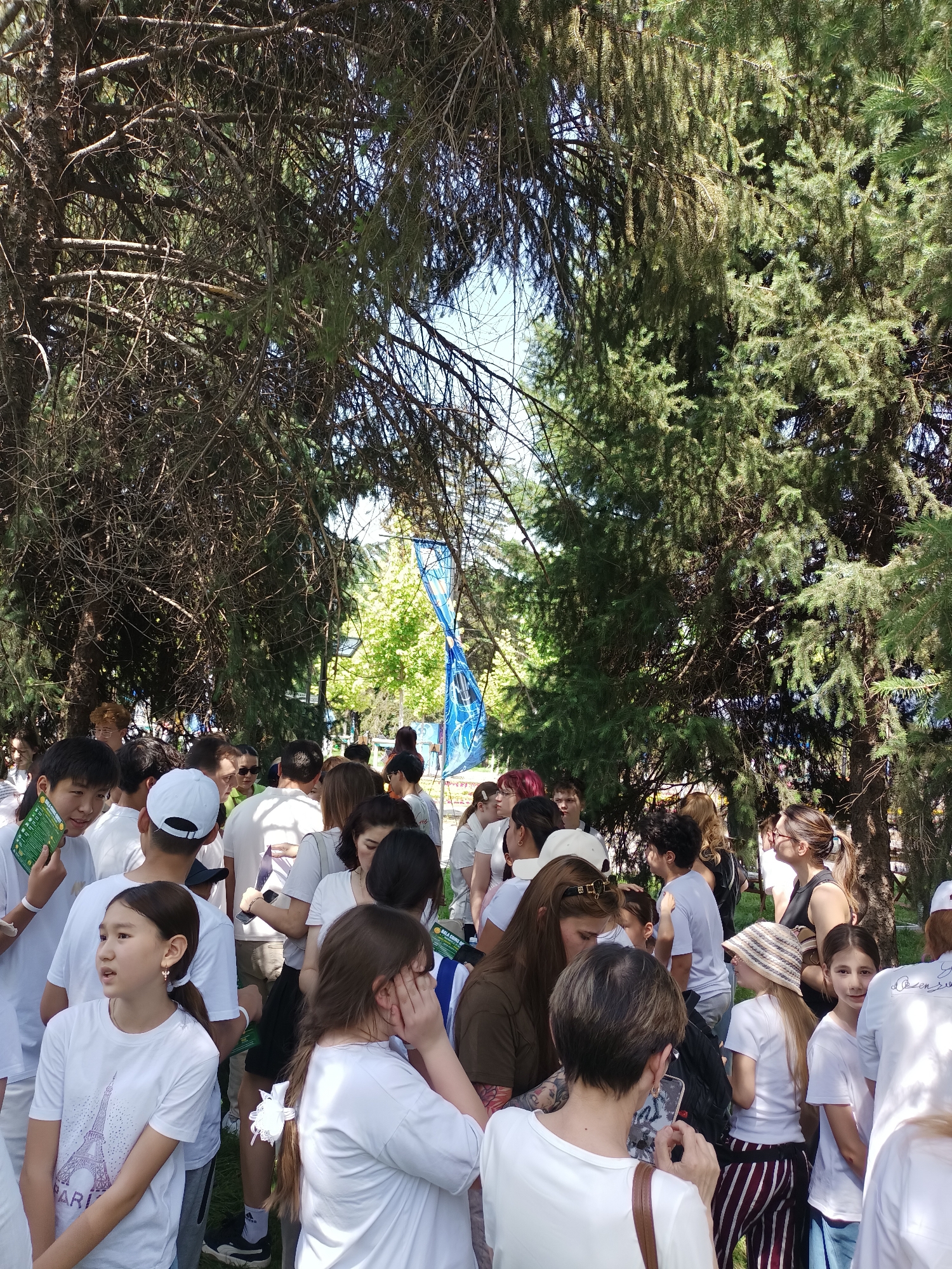 White-shirted crowds gather across Almaty parks in early morning