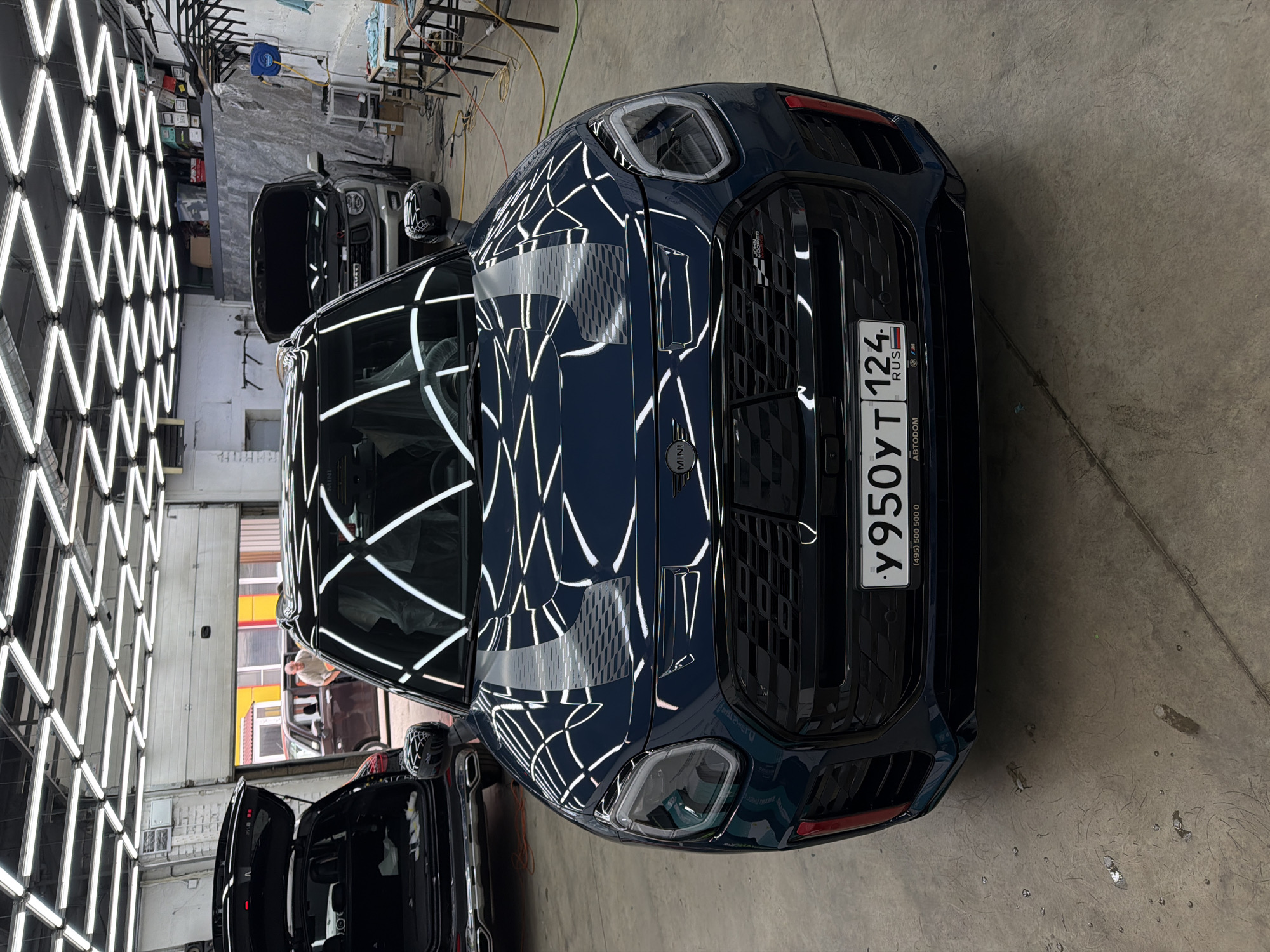 Window tinting session underway at a Krasnoyarsk detailing shop