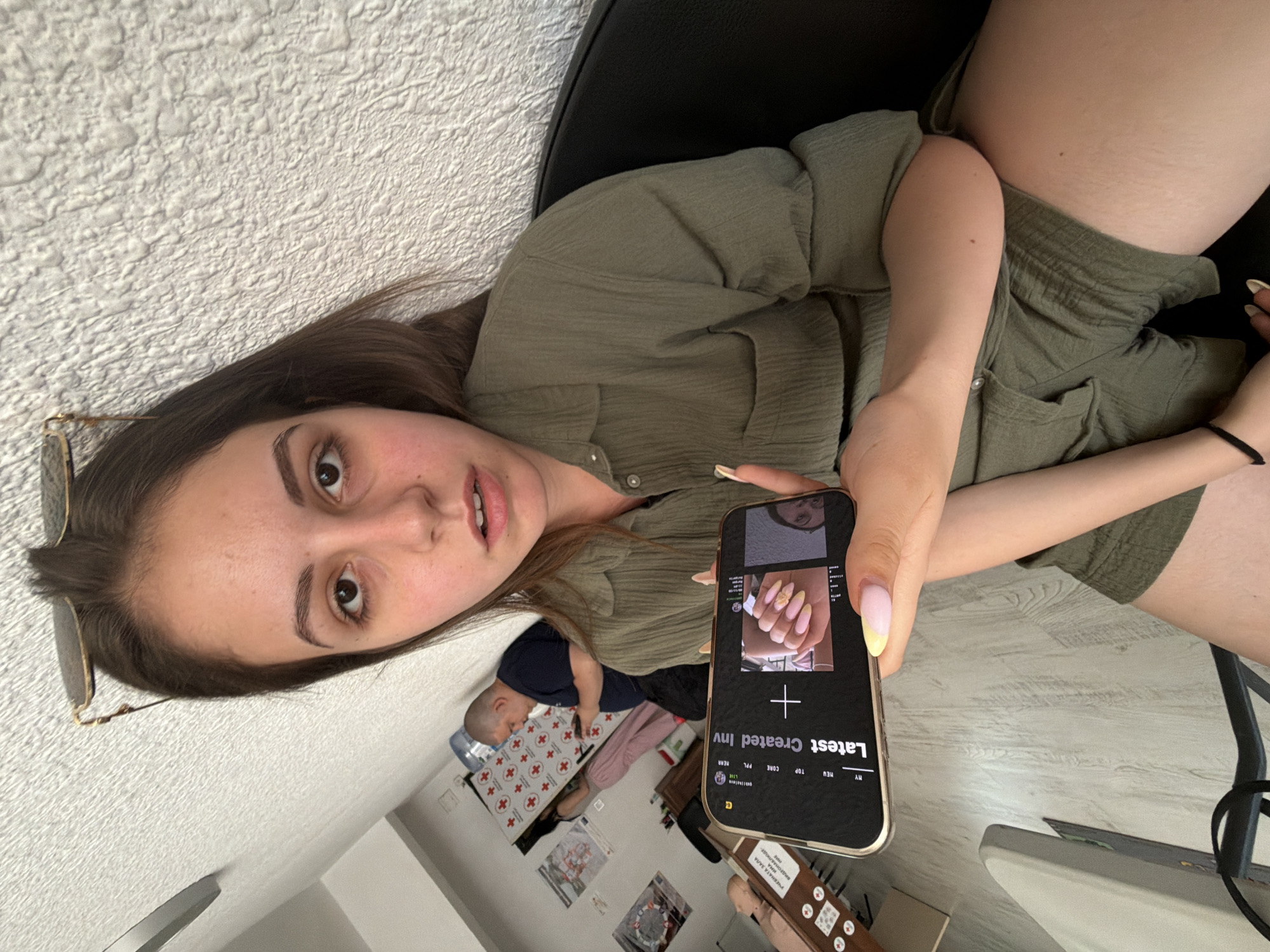 Woman takes multiple selfies during smartphone session in Burgas