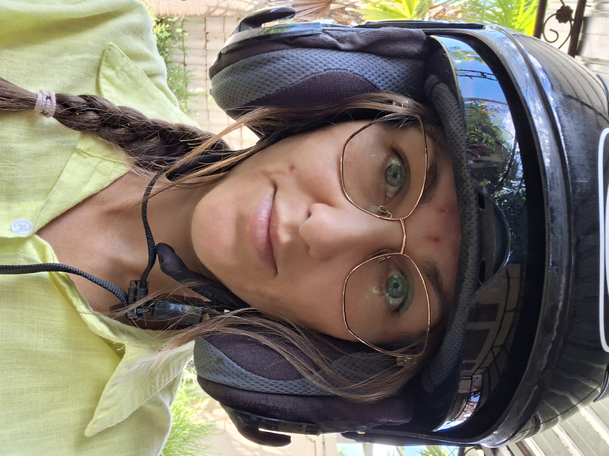 Morning scenes documented in Ubud: helmeted woman, porch dining