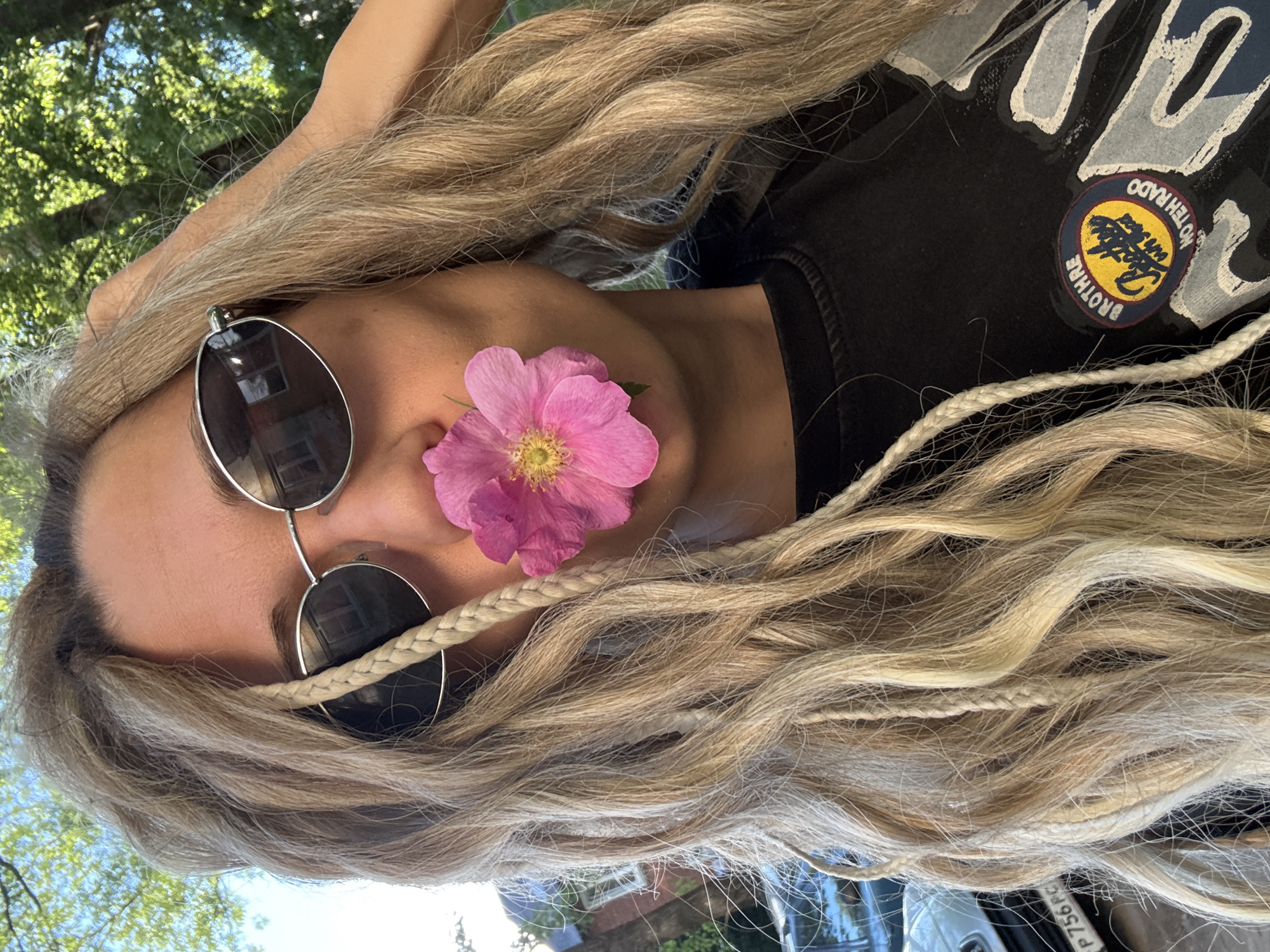 Blonde-braided individual photographed outdoors in Rusanovo, Russia