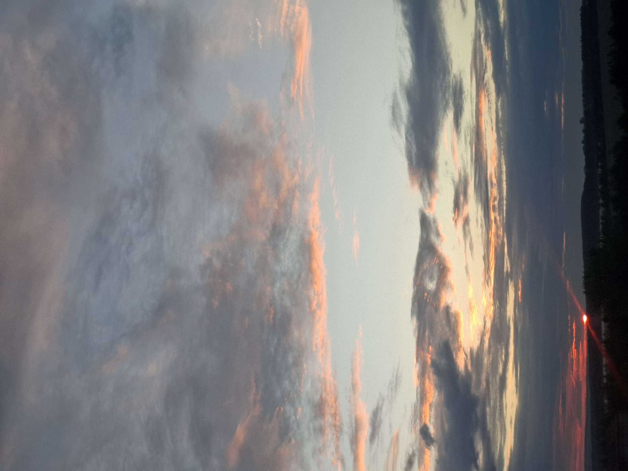 Foggy sunset captured over water near Khlevnoye, Russia