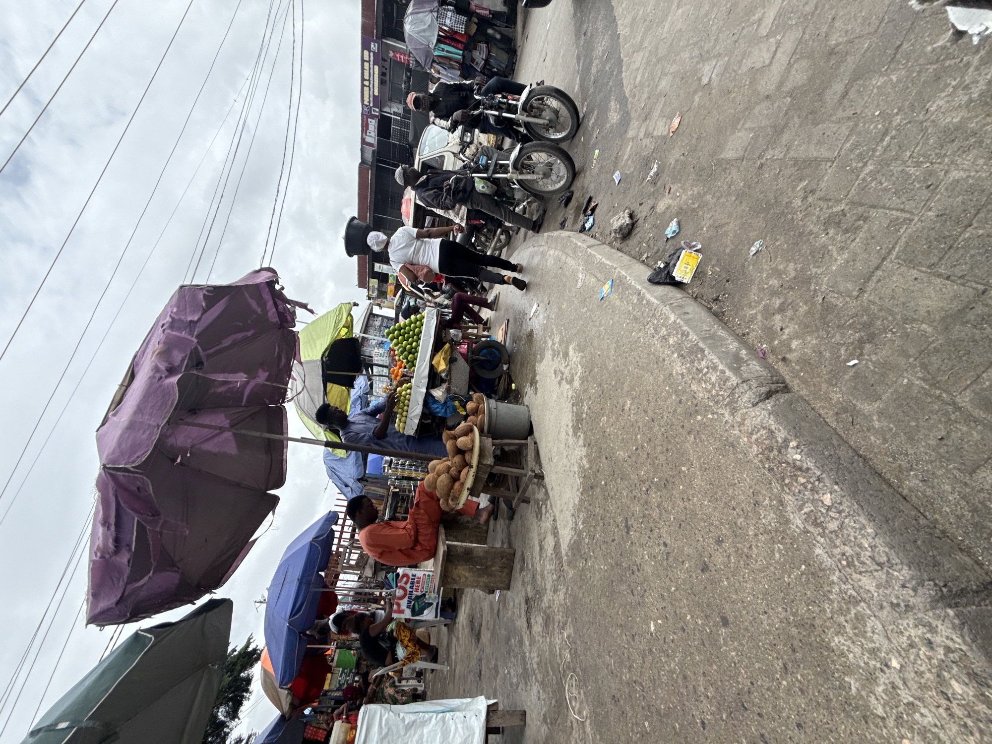 Street-level commerce and foot traffic in Ado, Nigeria