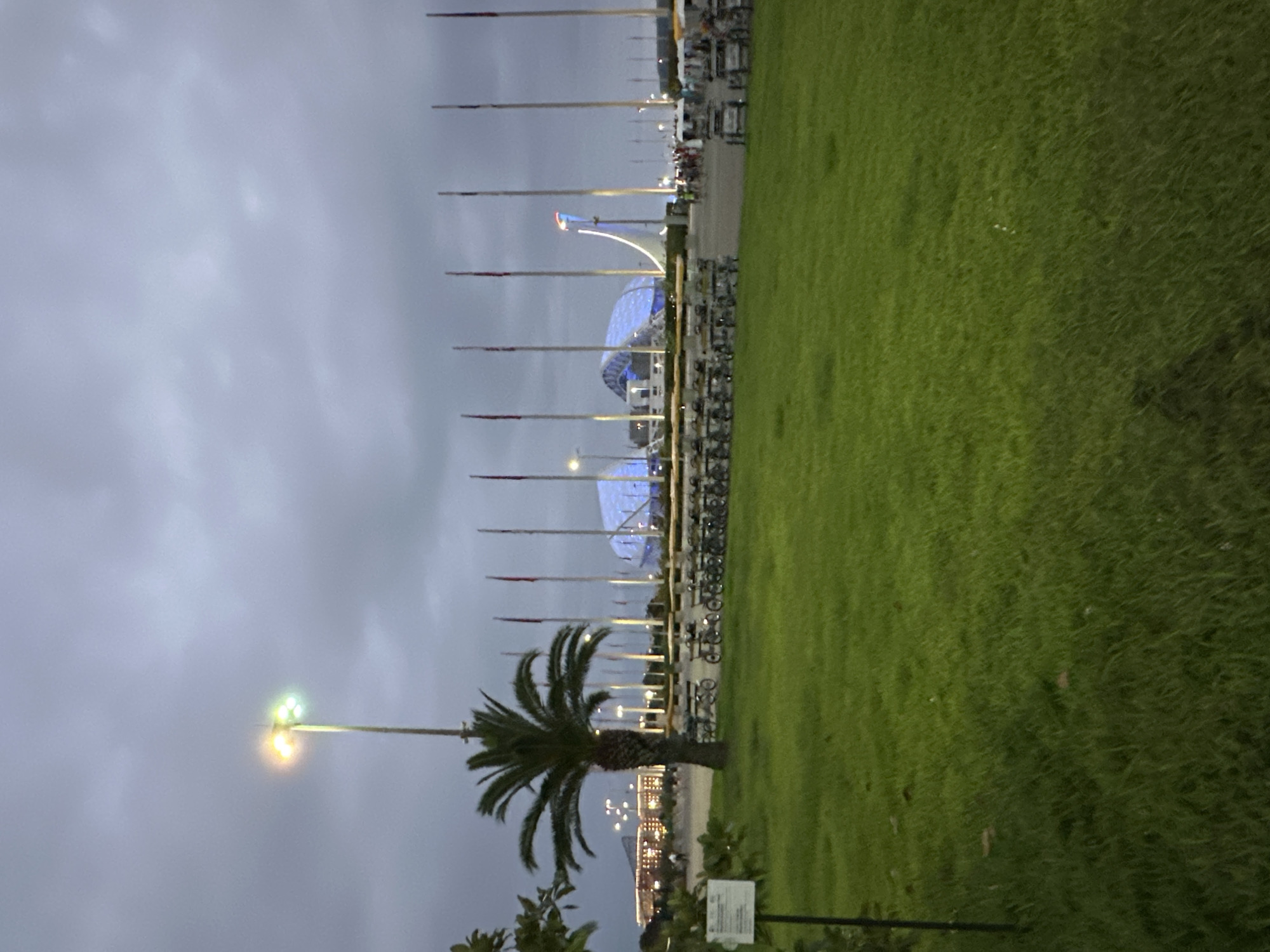 Sochi Olympic Park at dusk, stadium glowing blue
