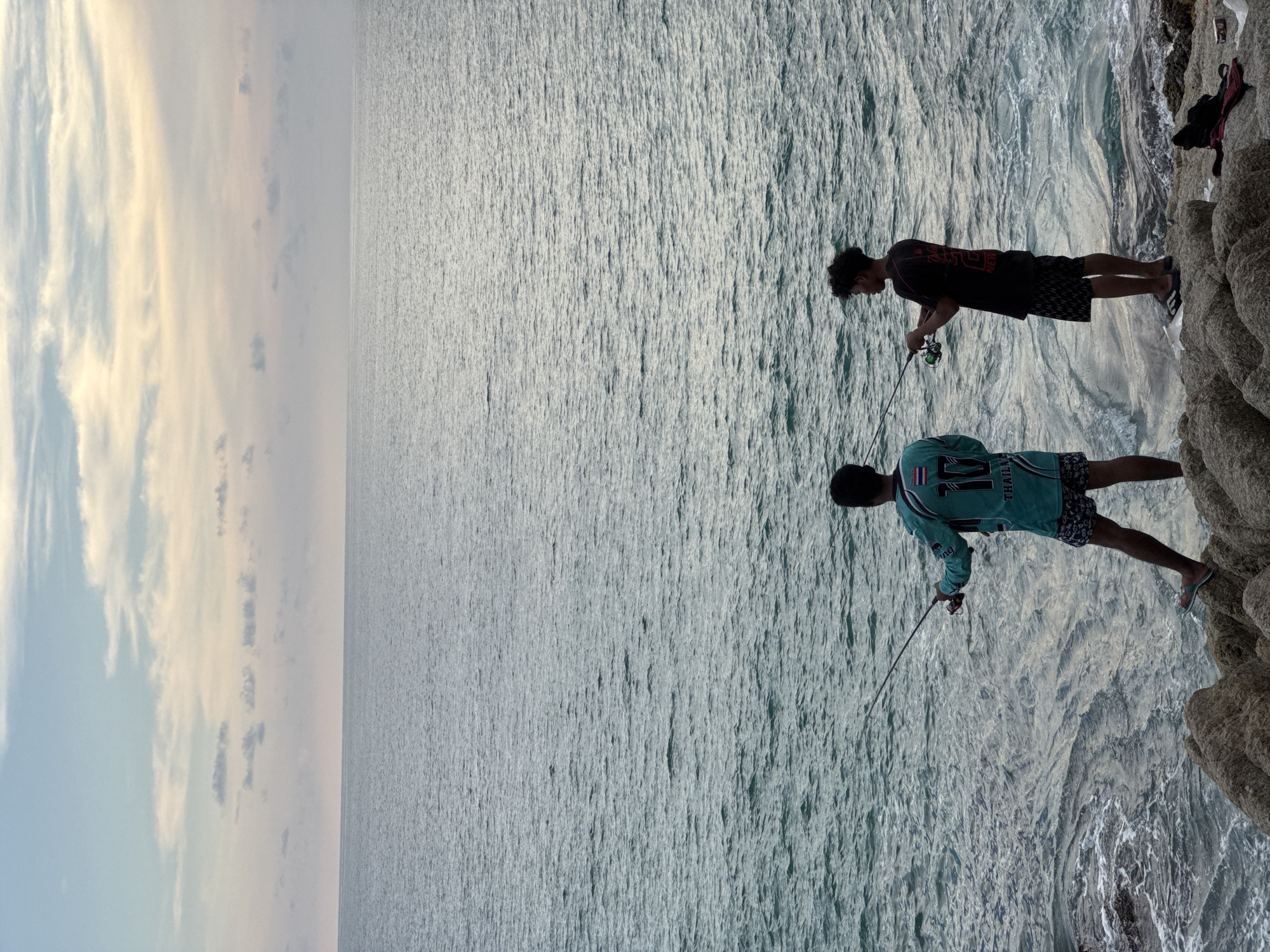 Rocky Choeng Thale coastline at dusk, Andaman sunset