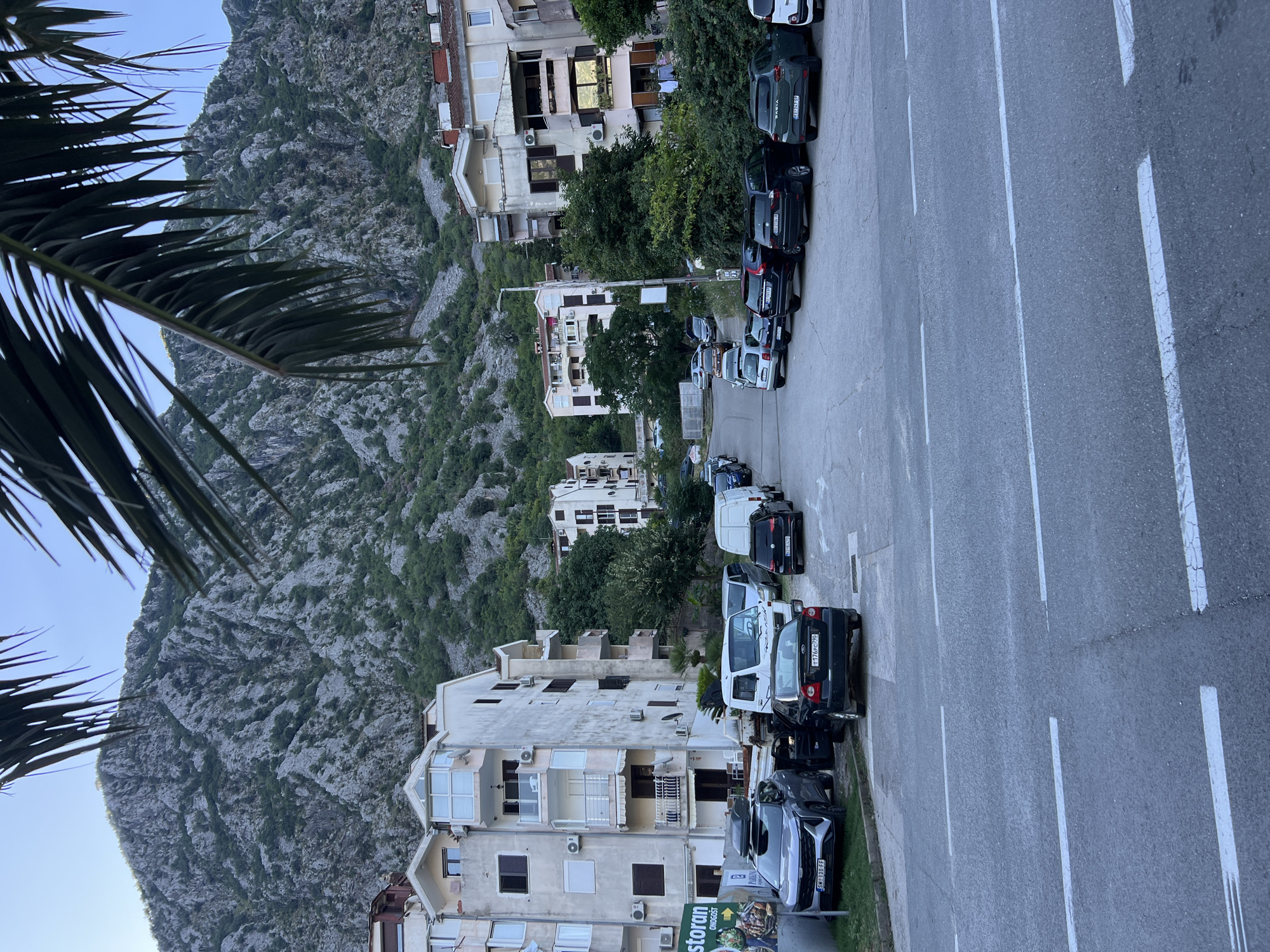 Risan, Montenegro: bay, boats, coastal road, and mountain streets