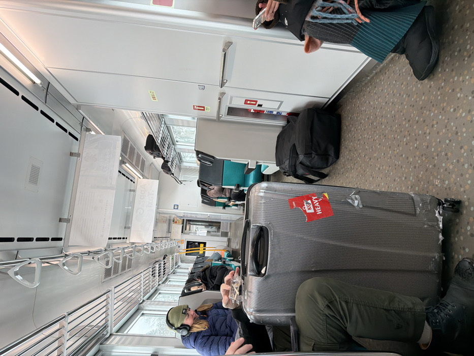 Heavy luggage blocks train aisle in Kutchan, Japan