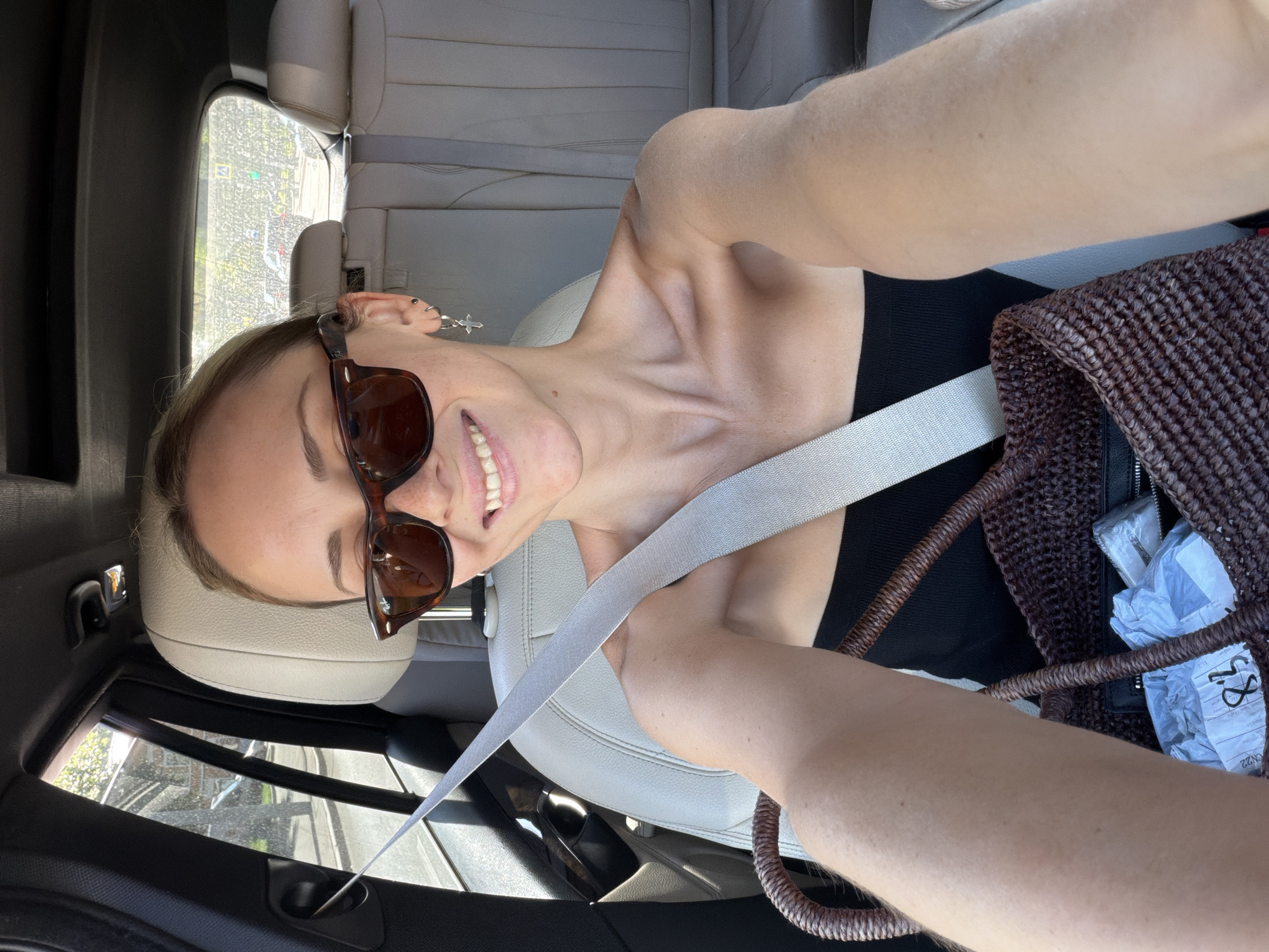 Quick selfies from the passenger seat of a moving Moscow car.