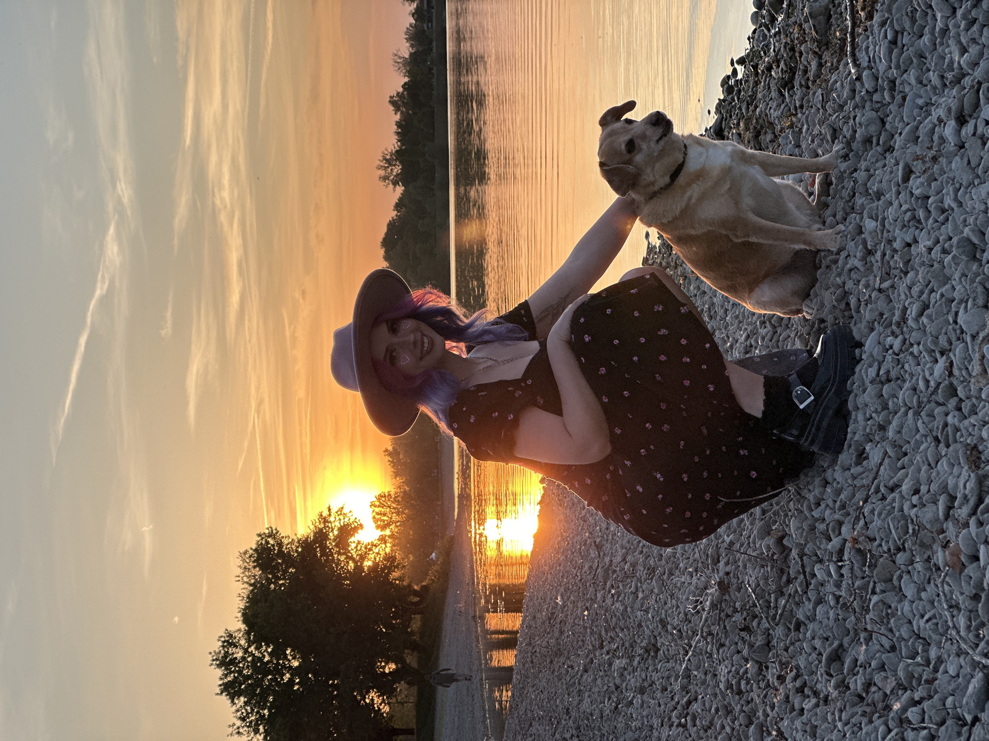 Woman, dog enjoy sunset moment on Zagreb rocky shore