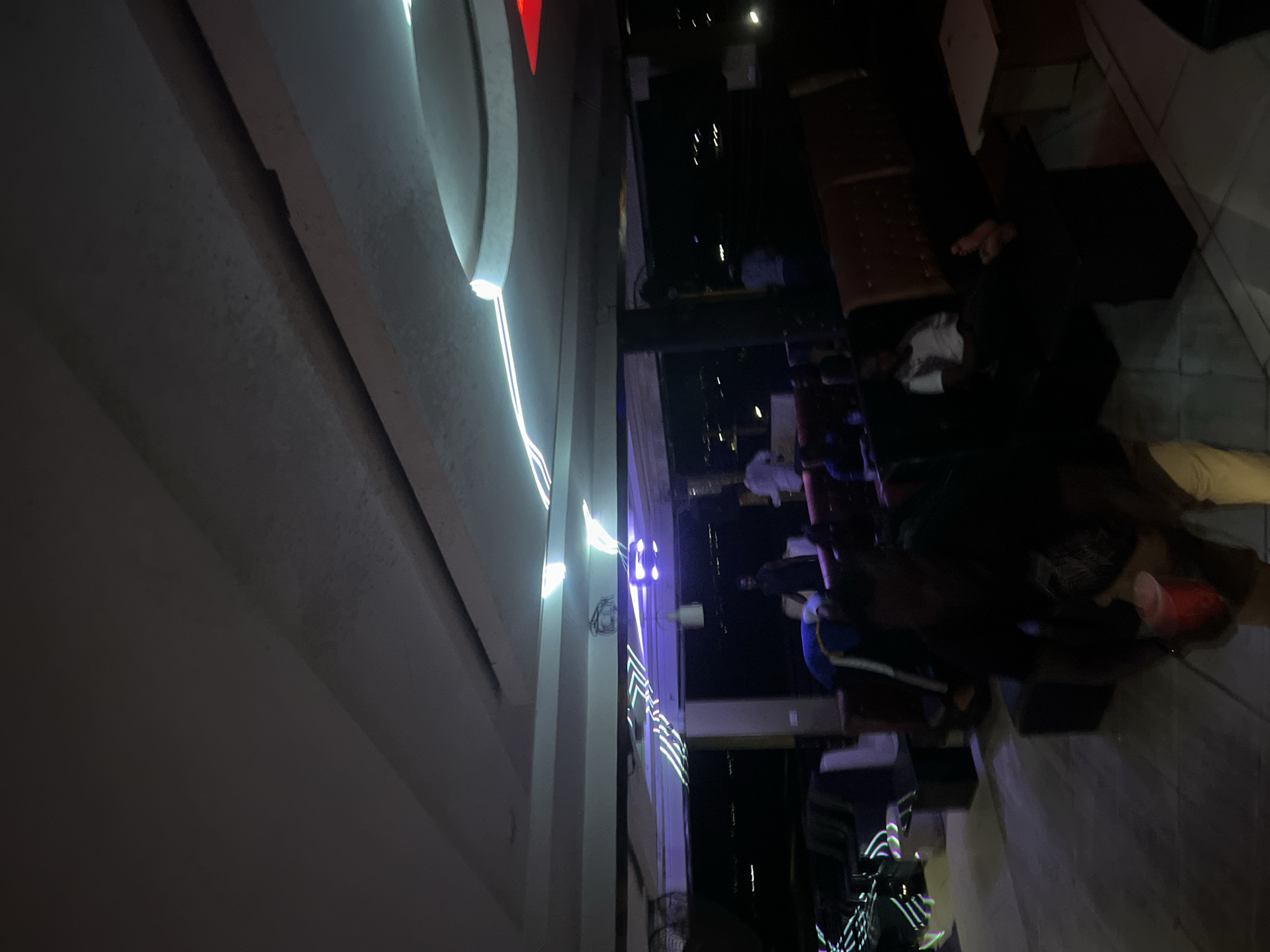 Nigerian nightclub patrons display luxury watches during evening gathering