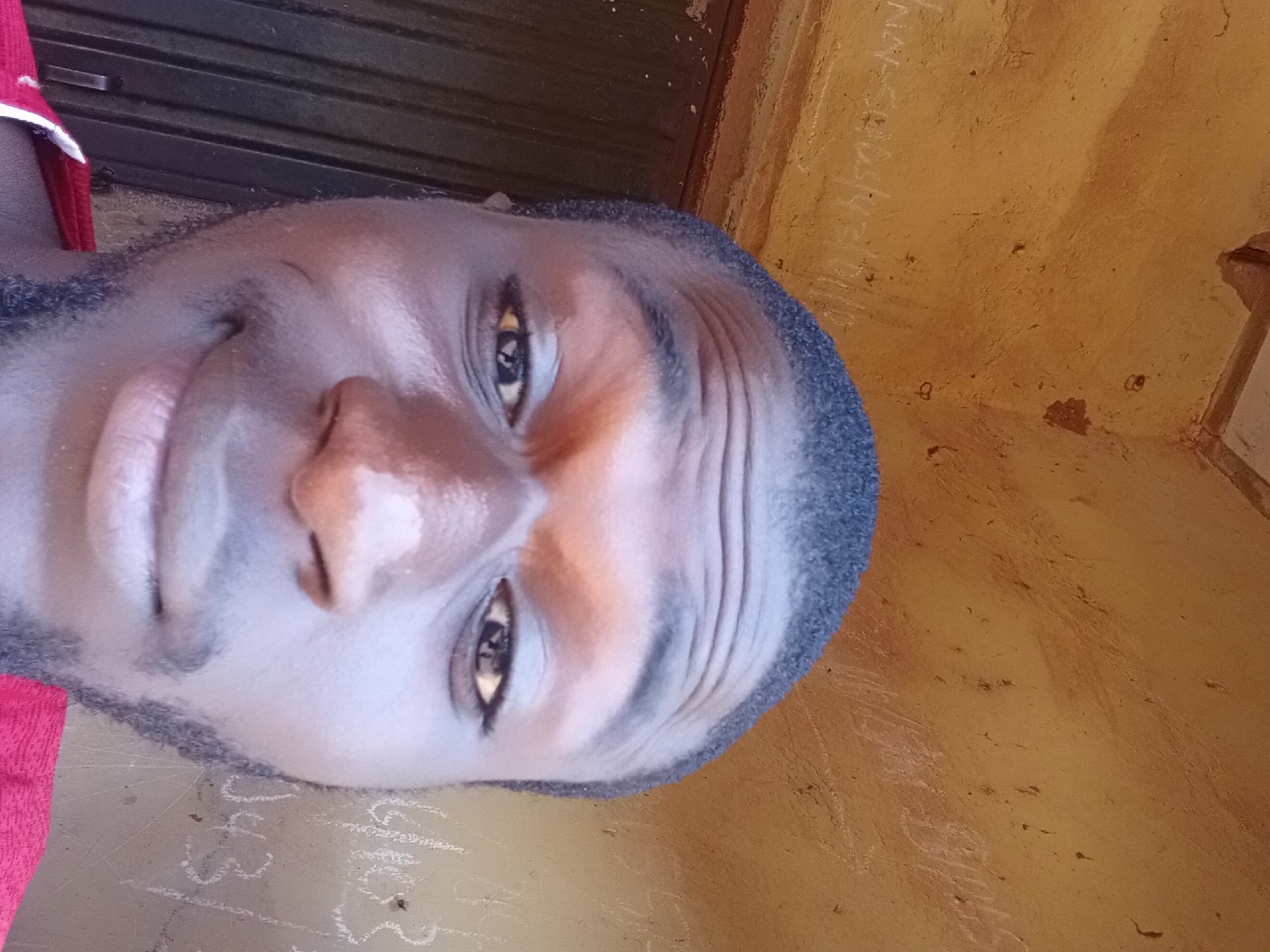 Selfie session against a concrete wall in Bukuru, Nigeria