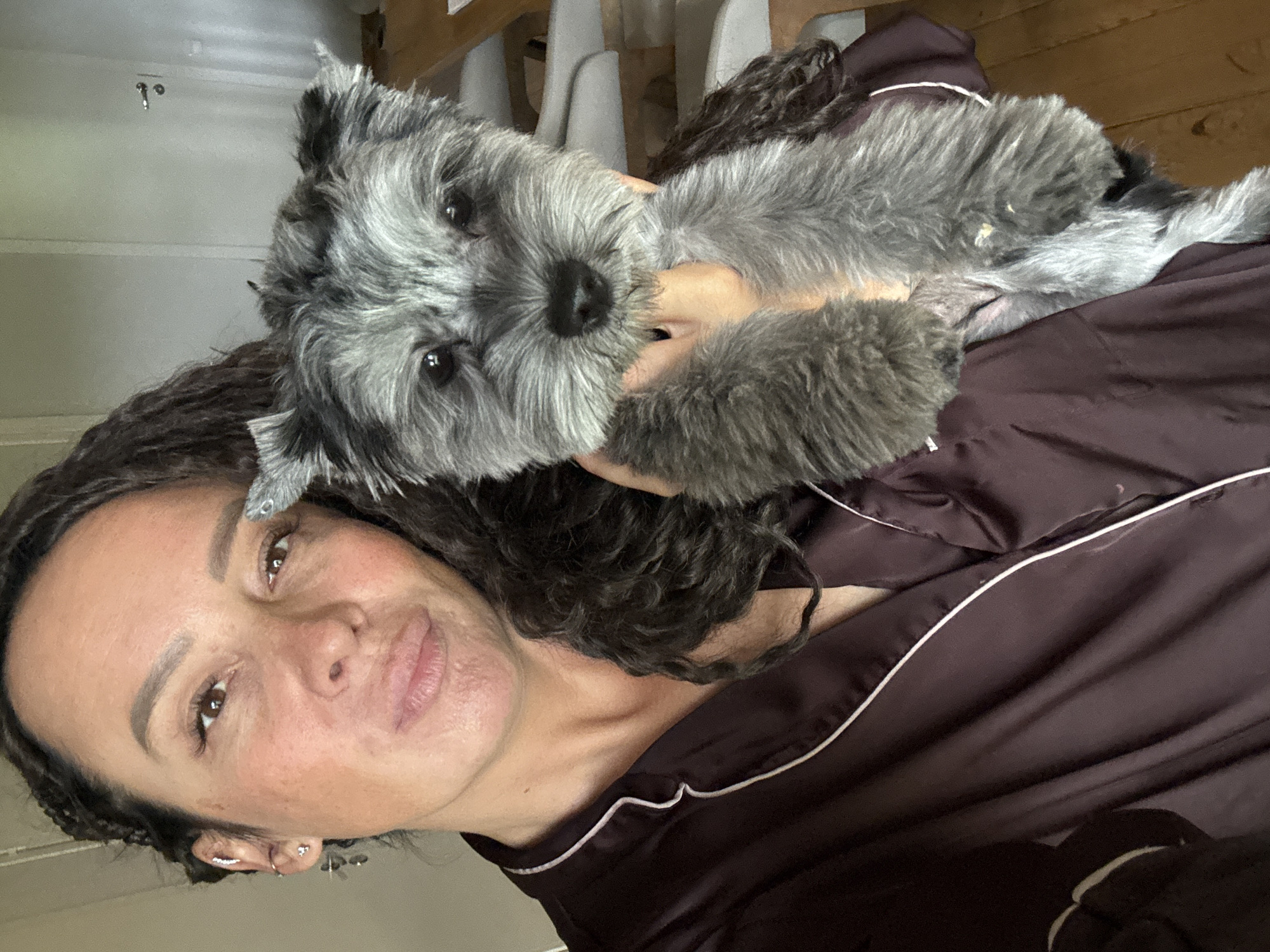 Woman and dog captured in casual morning moments in Chaikovsky