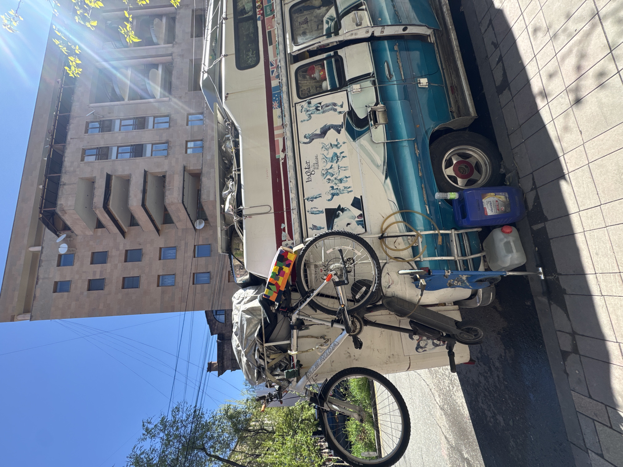 Distinctive Blue Double-Decker Vehicle Spotted on Yerevan Sidewalk