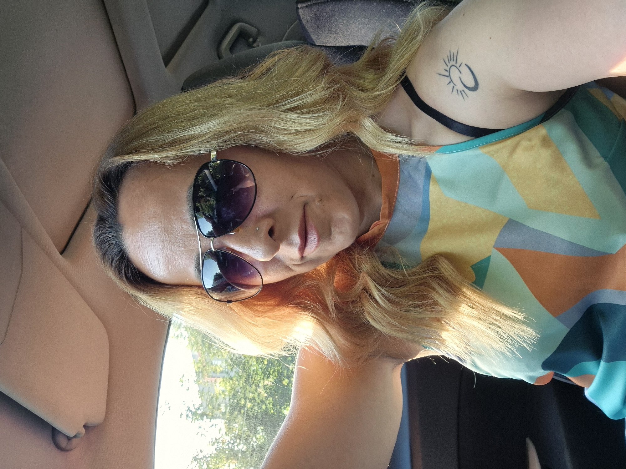 Woman Takes Multiple Selfies in Parked Car During Early Morning