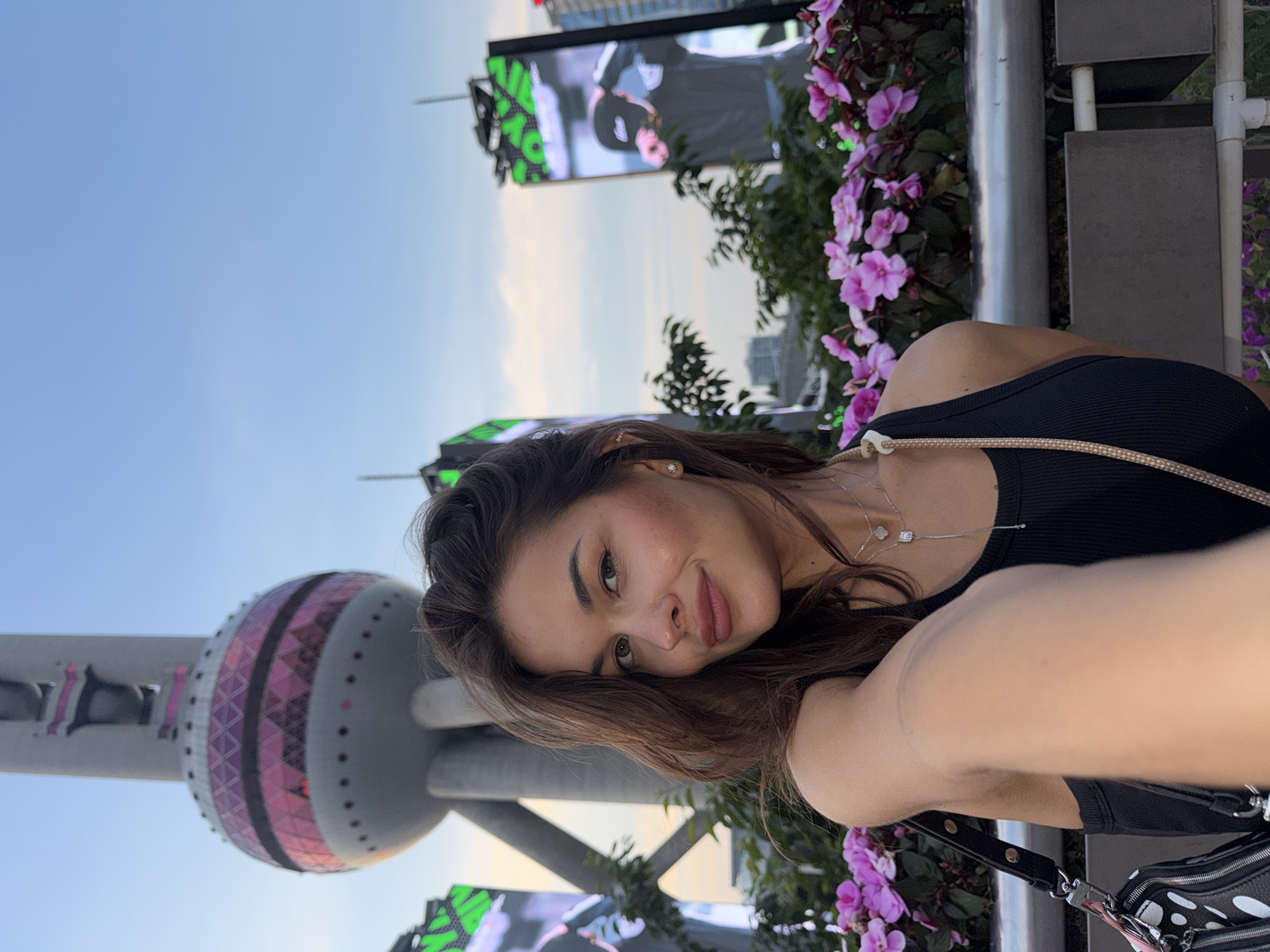 Tourists photograph themselves at Shanghai's Oriental Pearl Tower