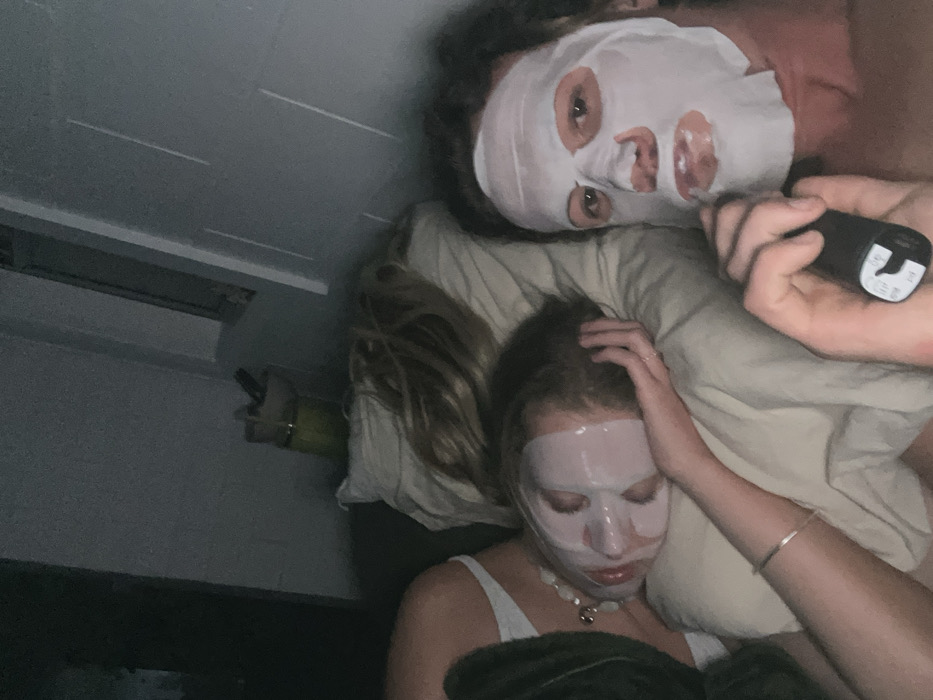 Two people resting in bedroom in Bulli, Australia