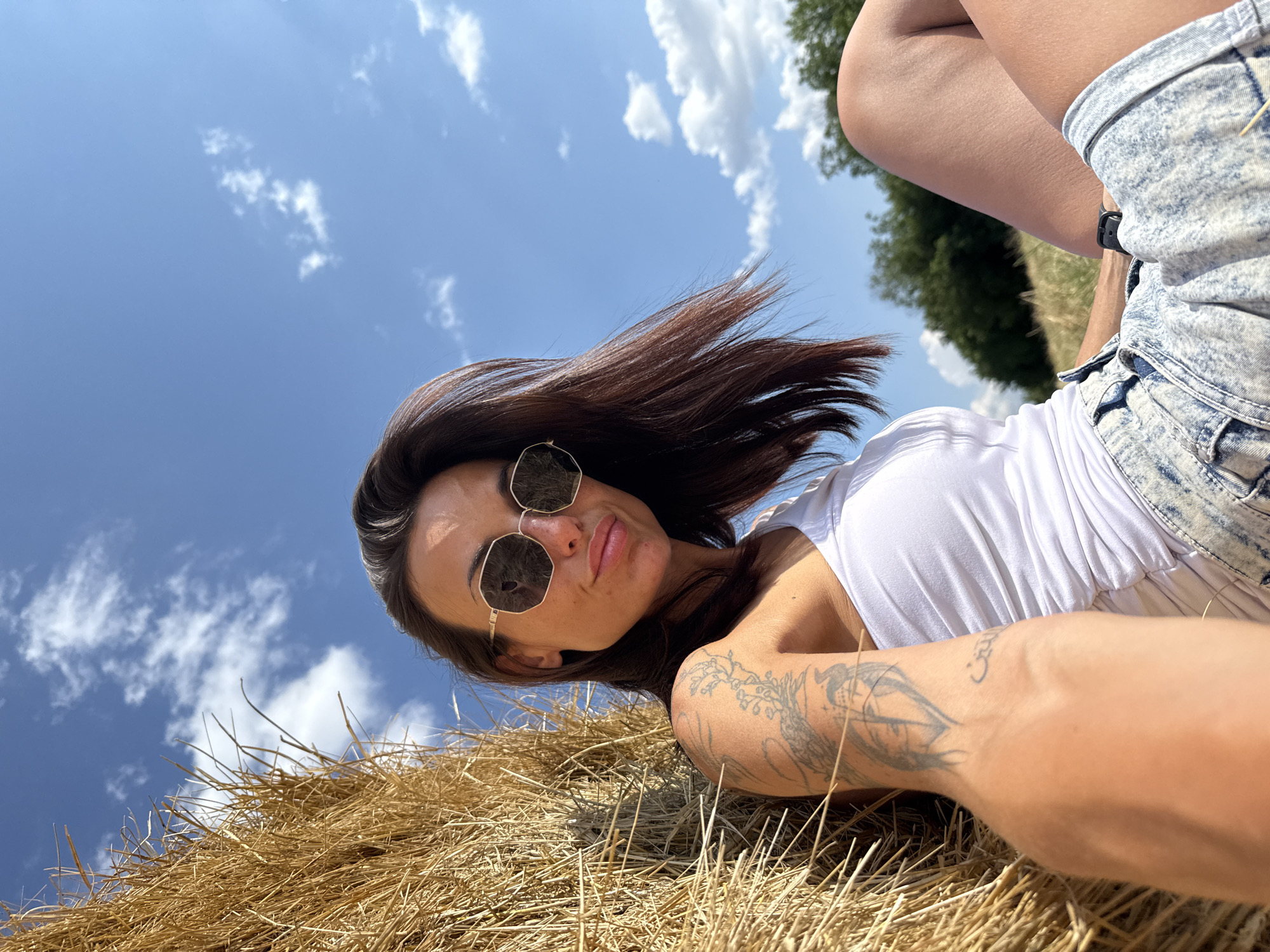 Hay field photo session among the bales in rural Bulgaria