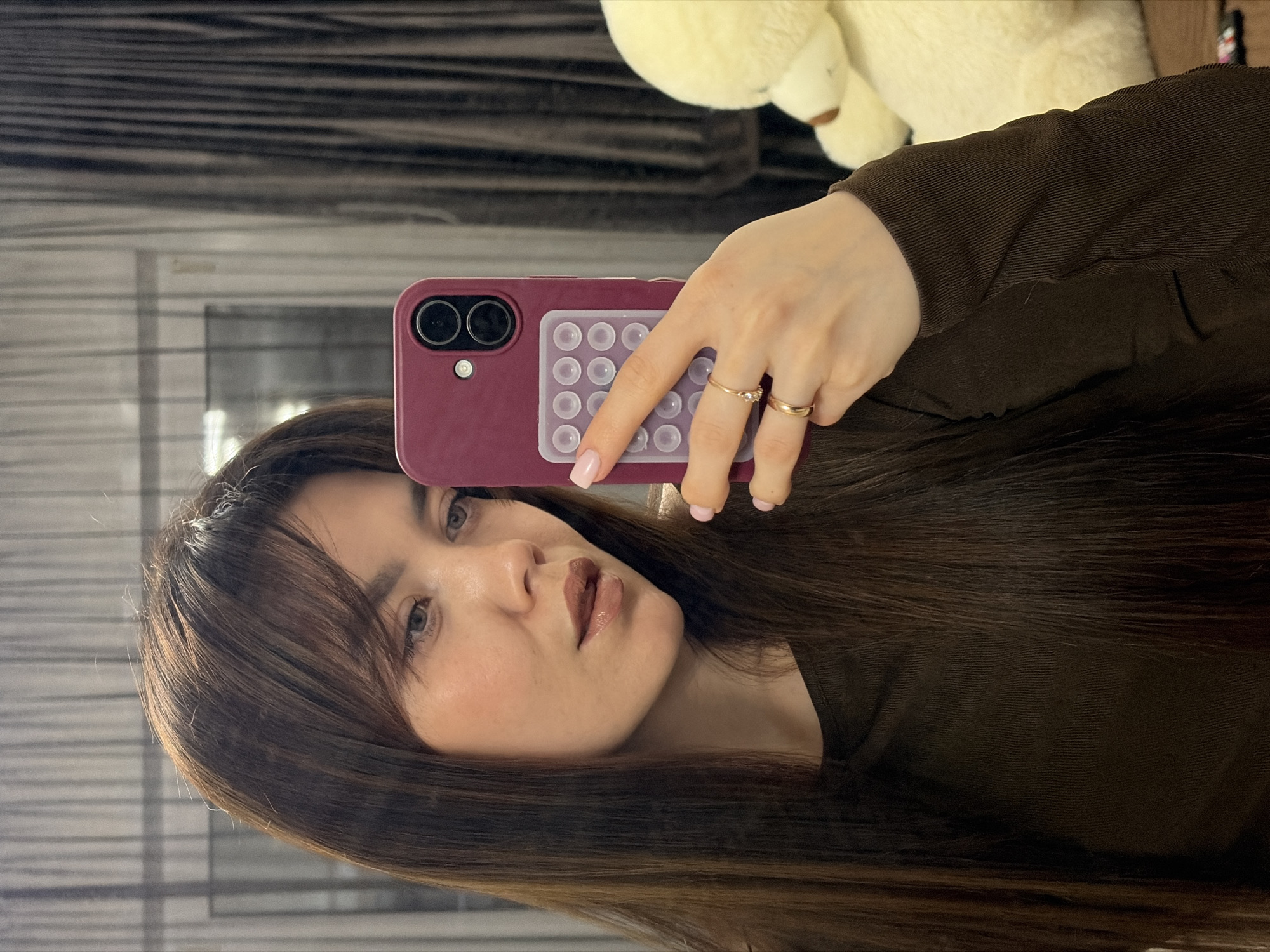 Woman takes selfies indoors in Votkinsk with cat present