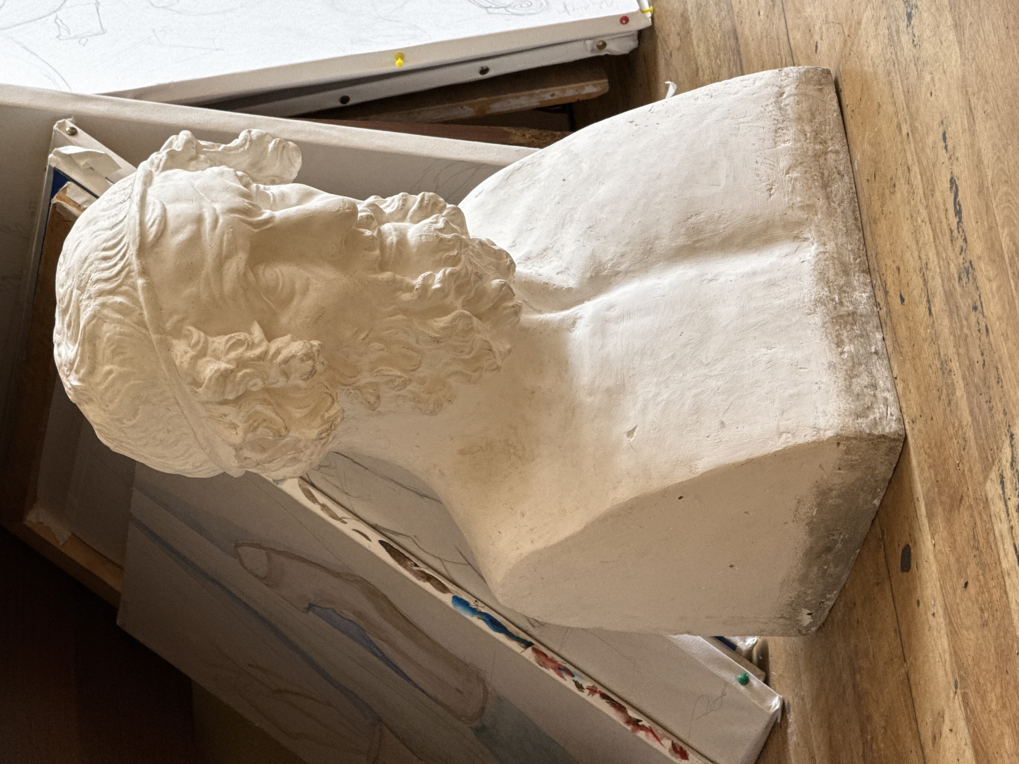 Artist studio documented in Yerevan showing sculptures and paintings