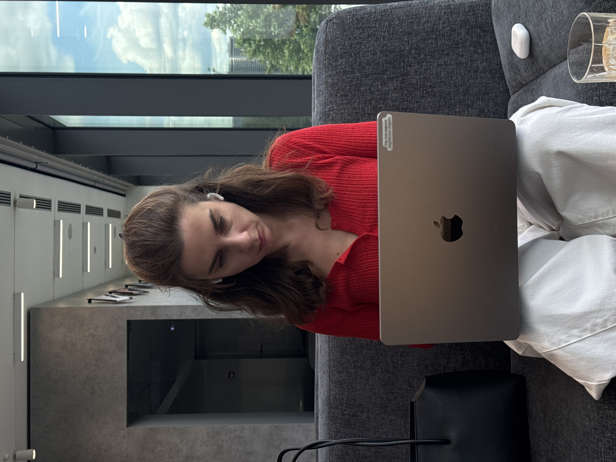 Woman works on laptop in Moscow office lounge