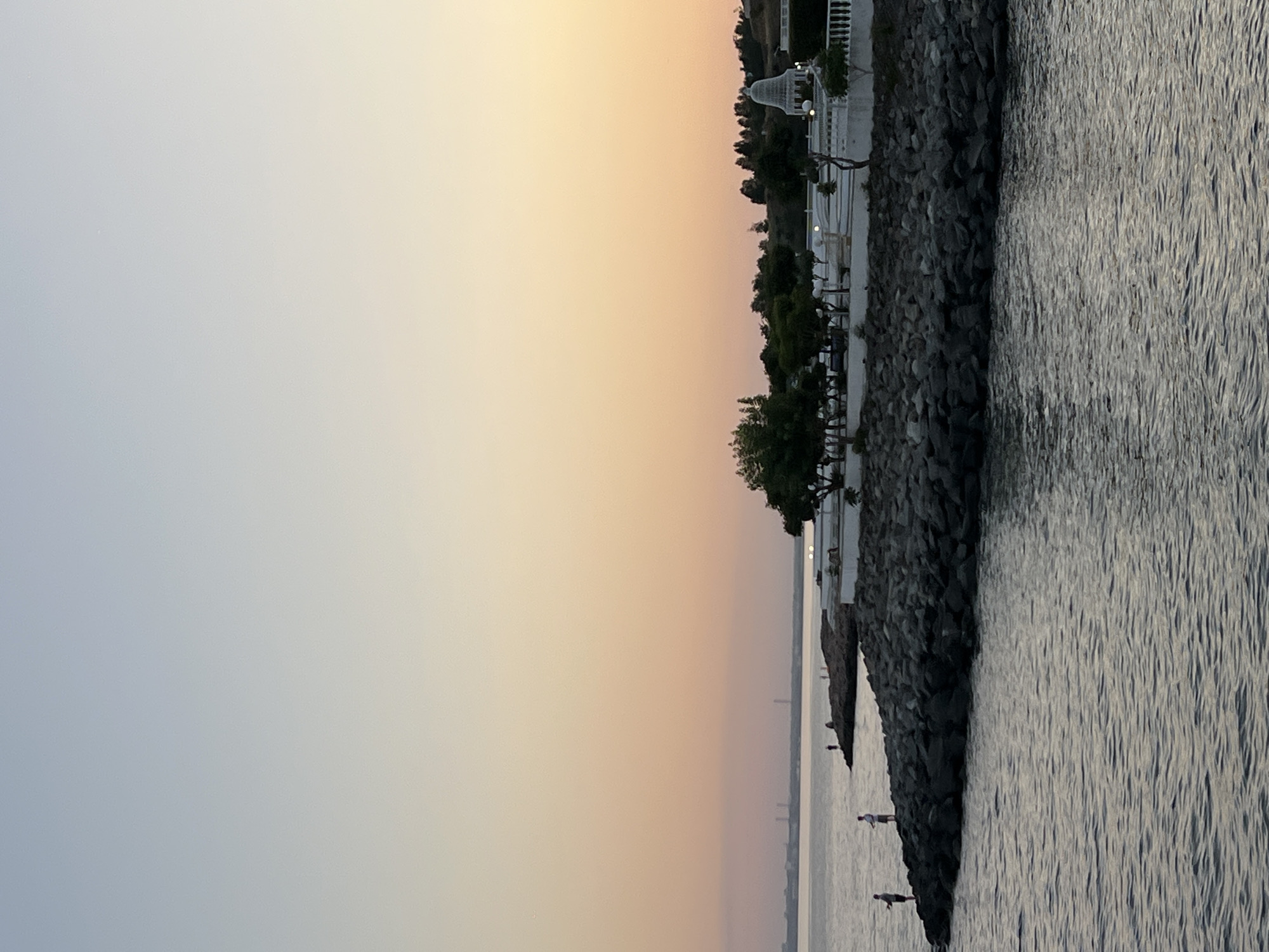 Sunset stroll along a Ukrainian beach resort promenade