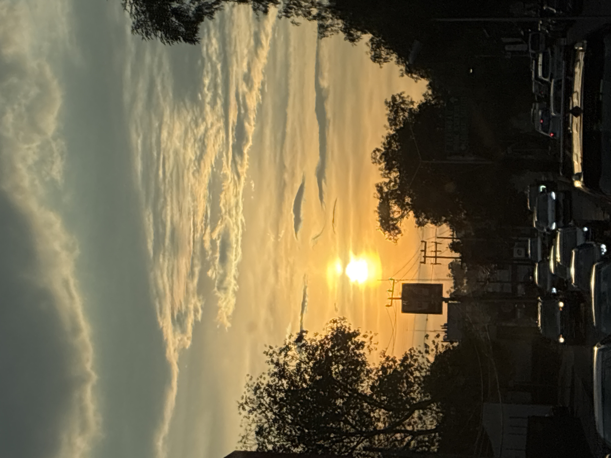 Sunset illuminates Naucalpan de Juárez streets amid evening traffic