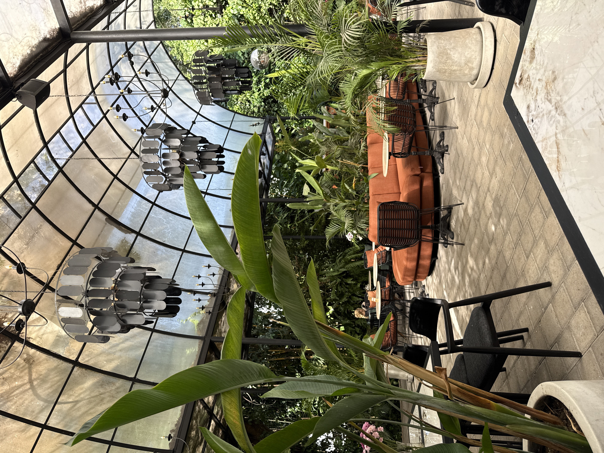 Glass-domed restaurant with tropical design observed in Ubud
