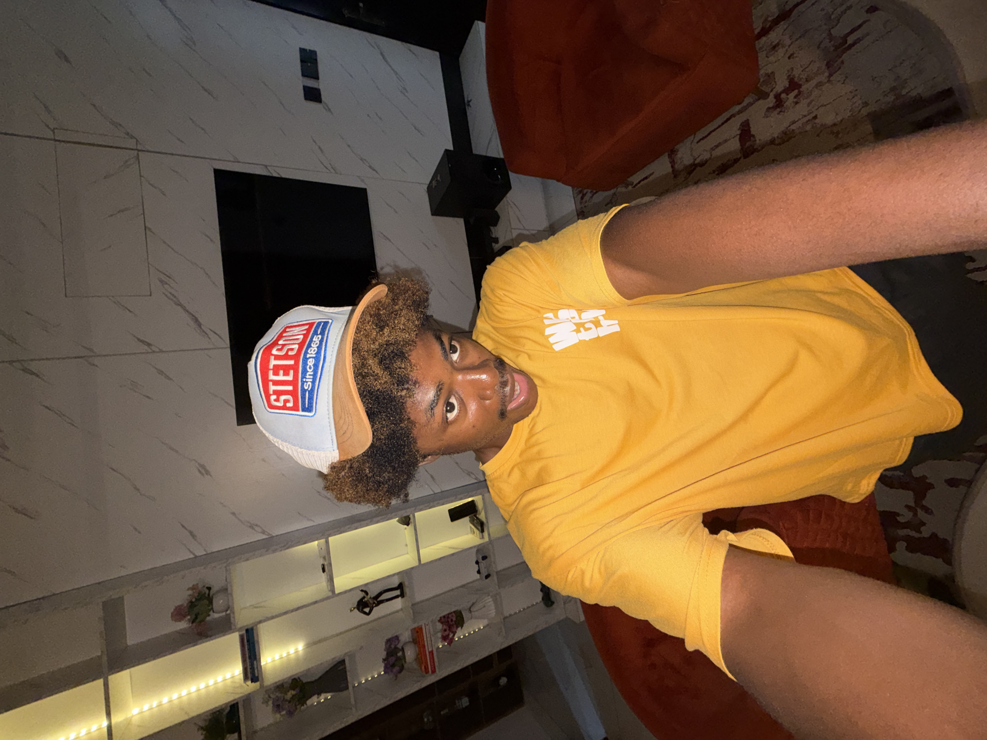 Man resting on carpet in modern Nigerian home
