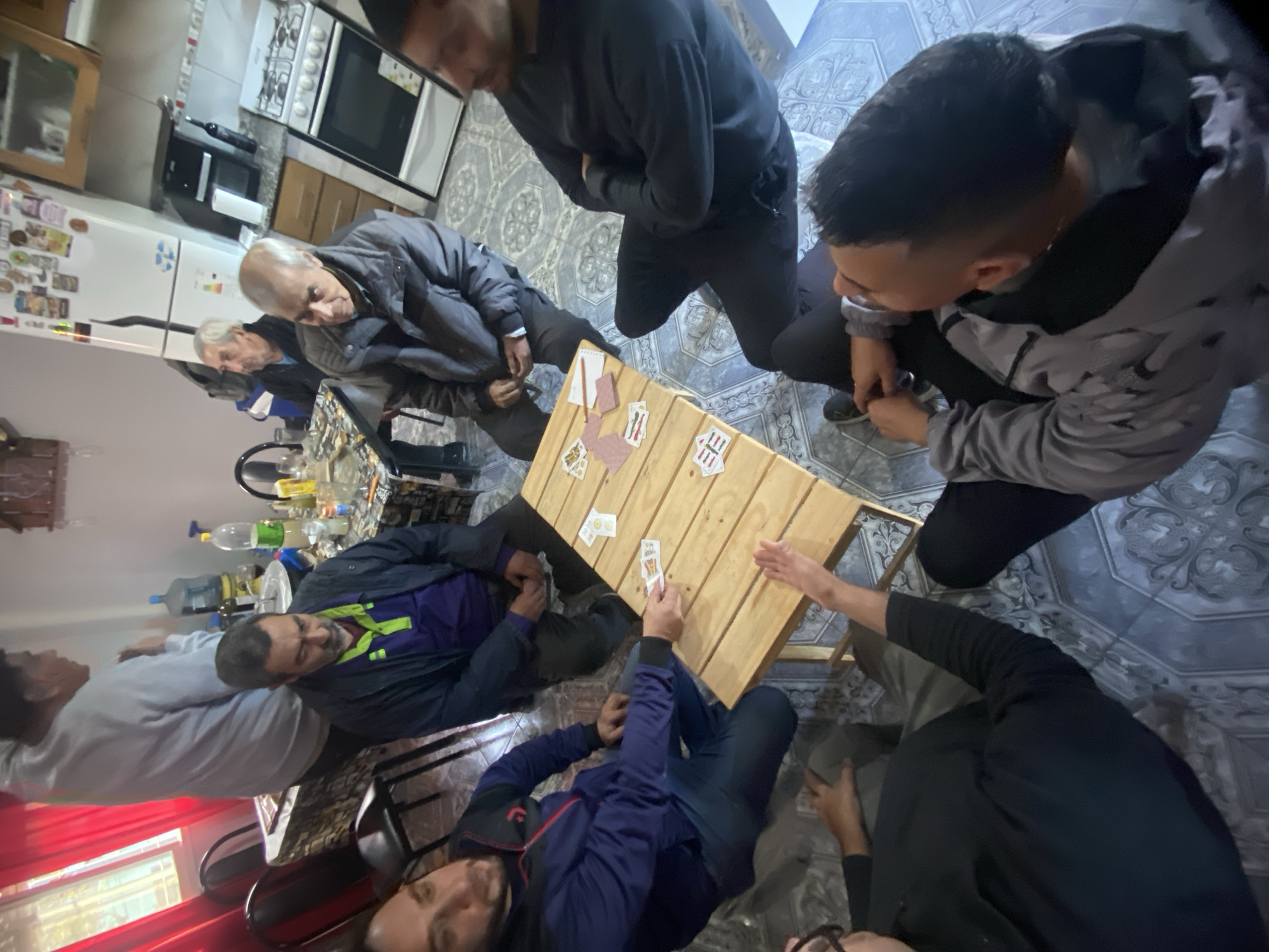 Card game gathering observed in Berazategui home setting