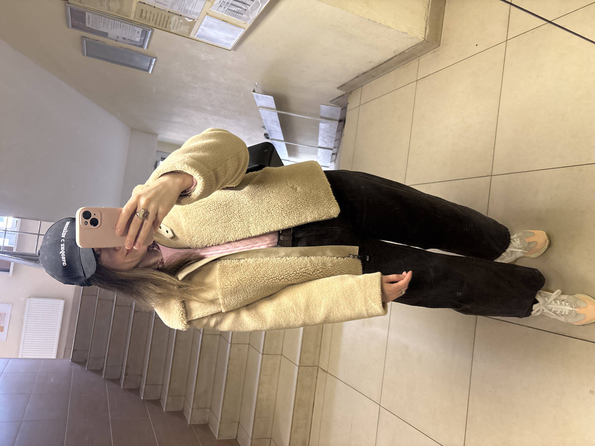Person takes selfie in building in Kudrovo, Russia