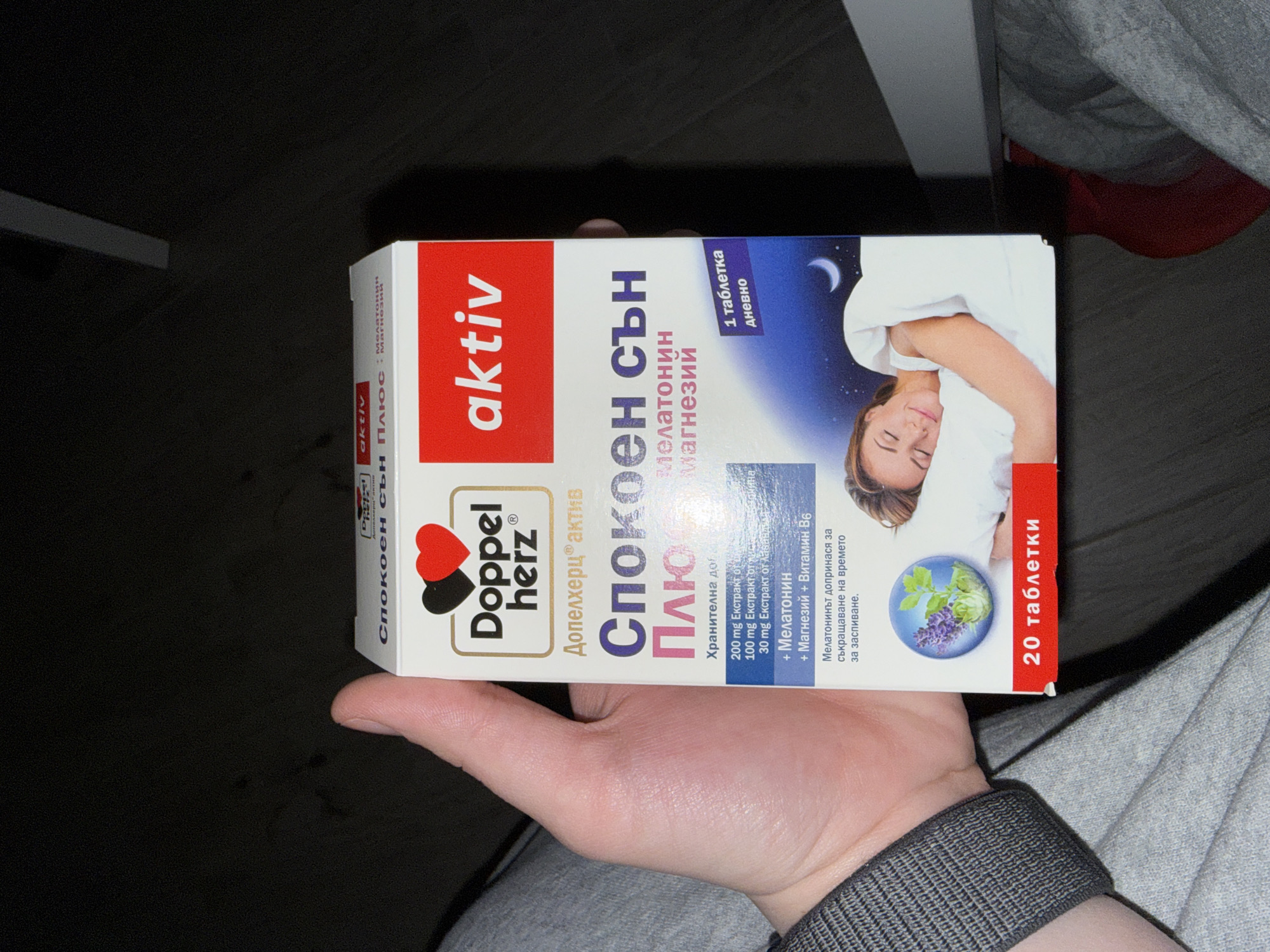 Person holds sleep supplement box in Sofia, Bulgaria