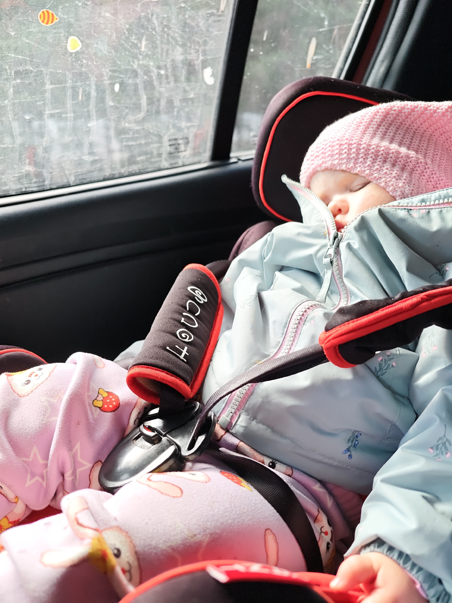 Baby sleeps peacefully in car seat in Chaikovsky