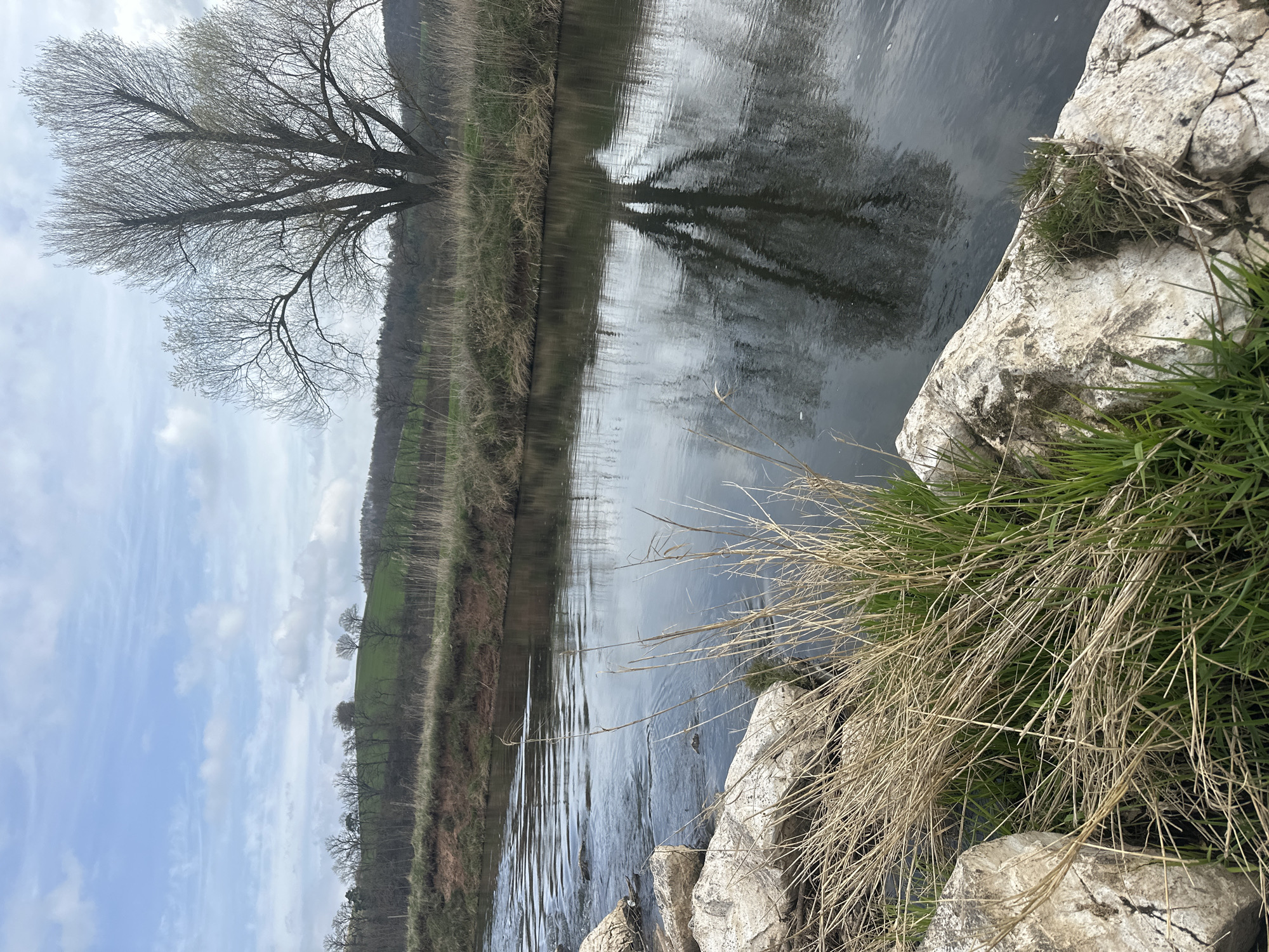 Man stands on rocks in German river