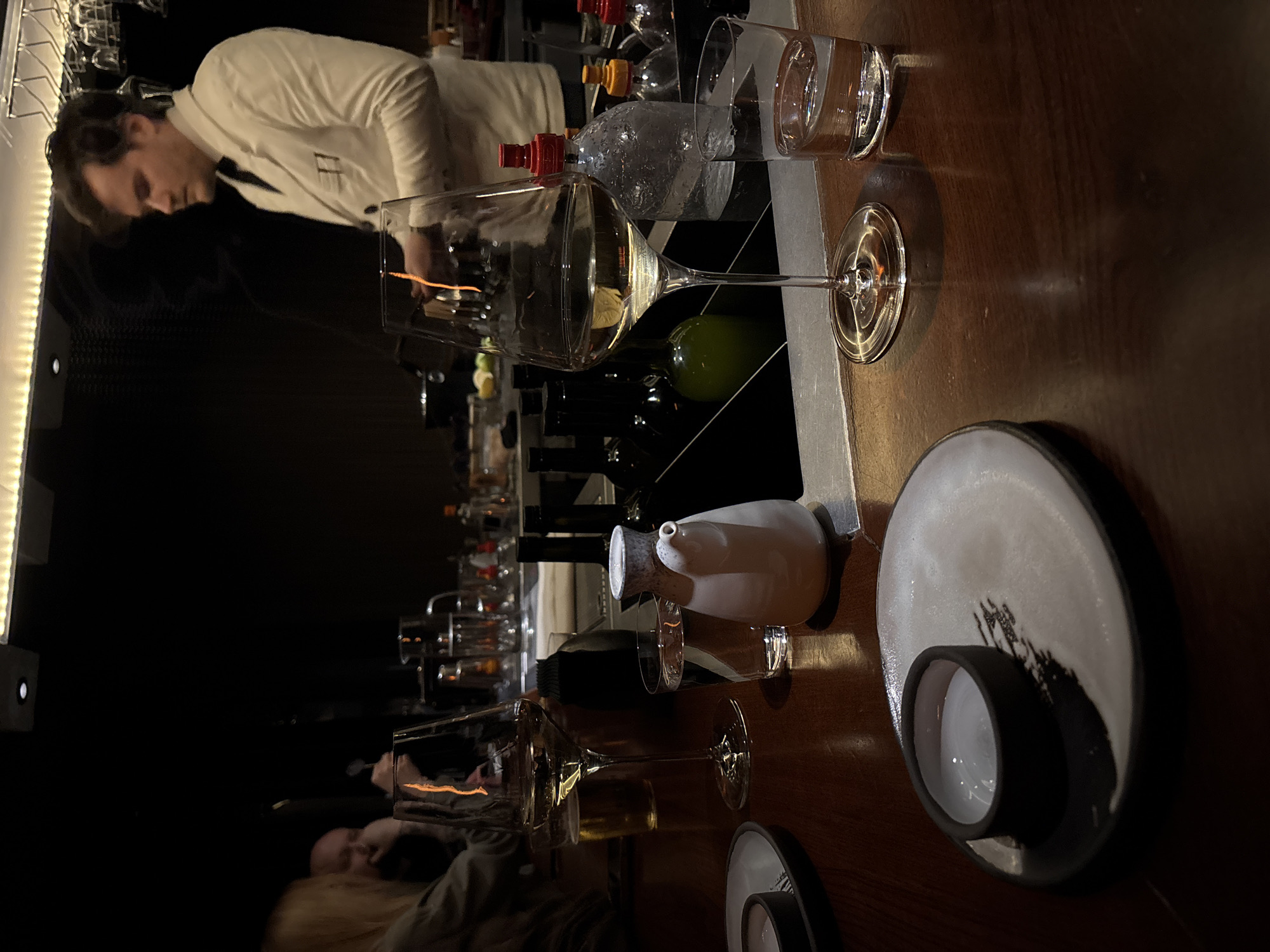 Bartender serves drinks at Moscow bar during evening shift