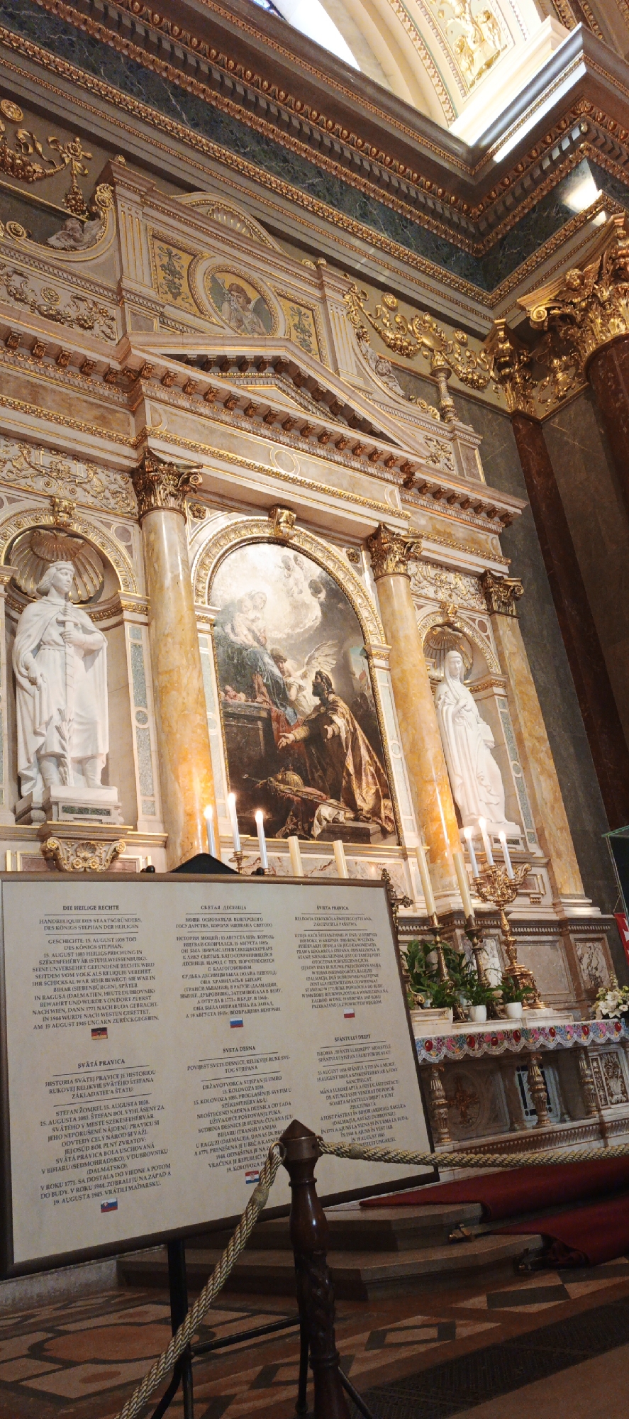 Tourist documents ornate interiors of Budapest's St. Stephen's Basilica