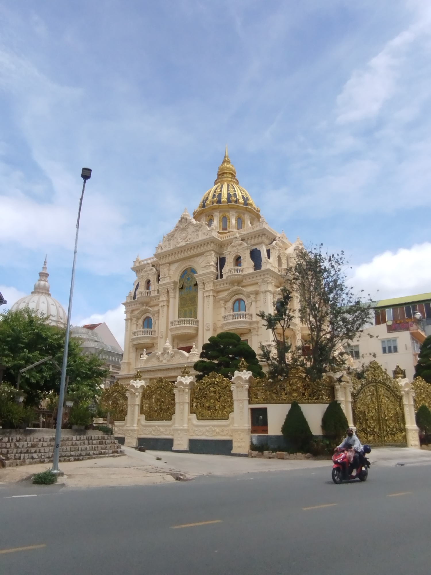 Ornate golden-domed buildings documented across Da Lat, Vietnam