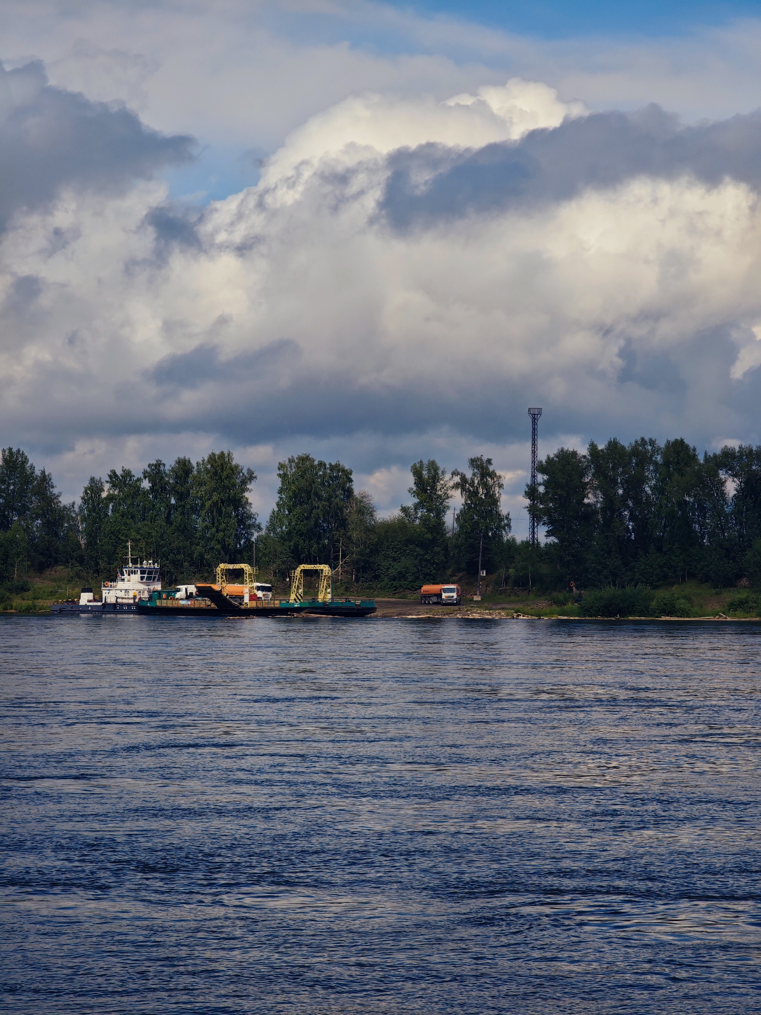 Ferry hauls trucks across the Angara River in rural Siberia