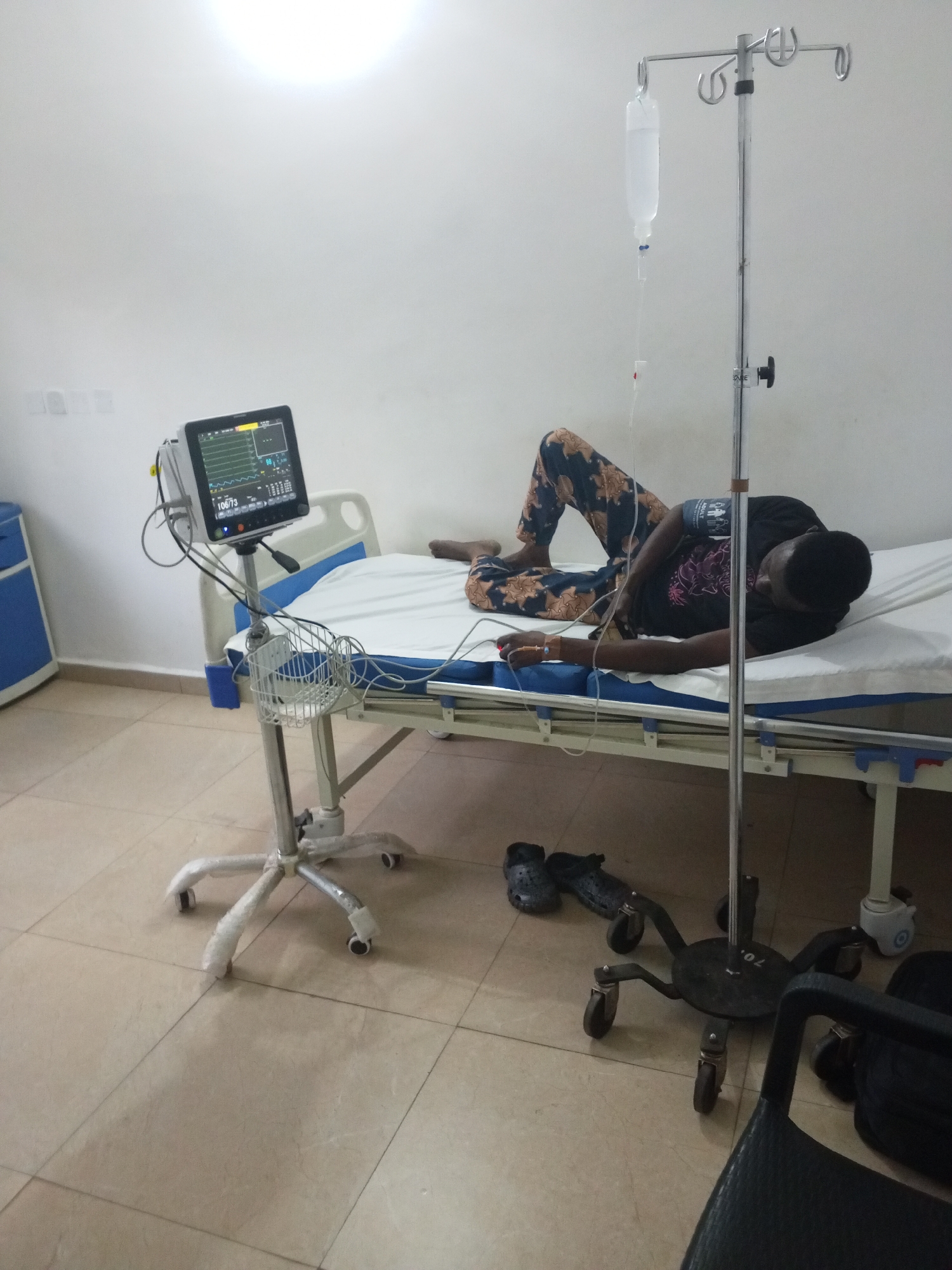 Young man hospitalized with IV, monitors in Sabon Tasha