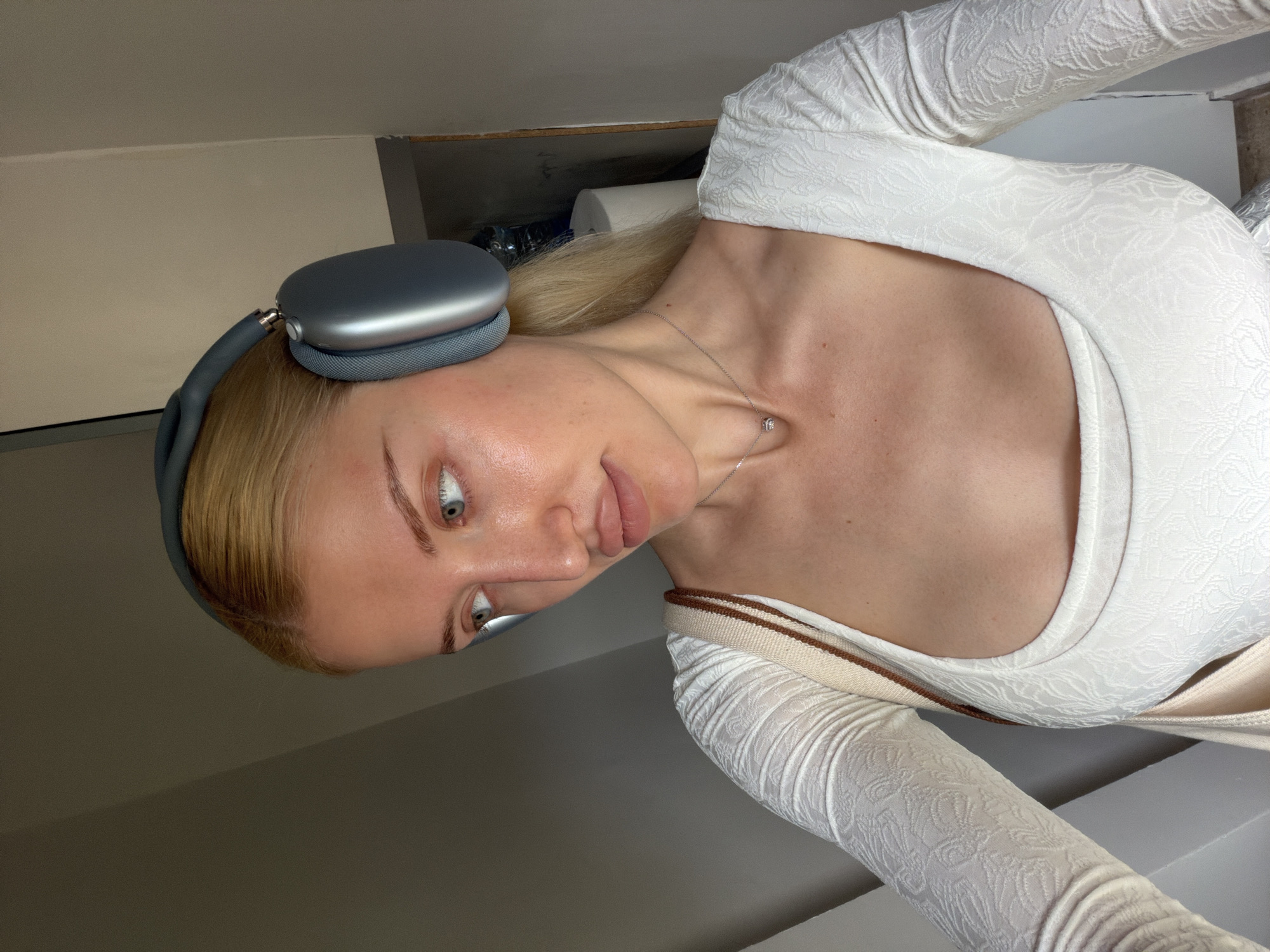 Woman in headphones observed indoors in Belgrade