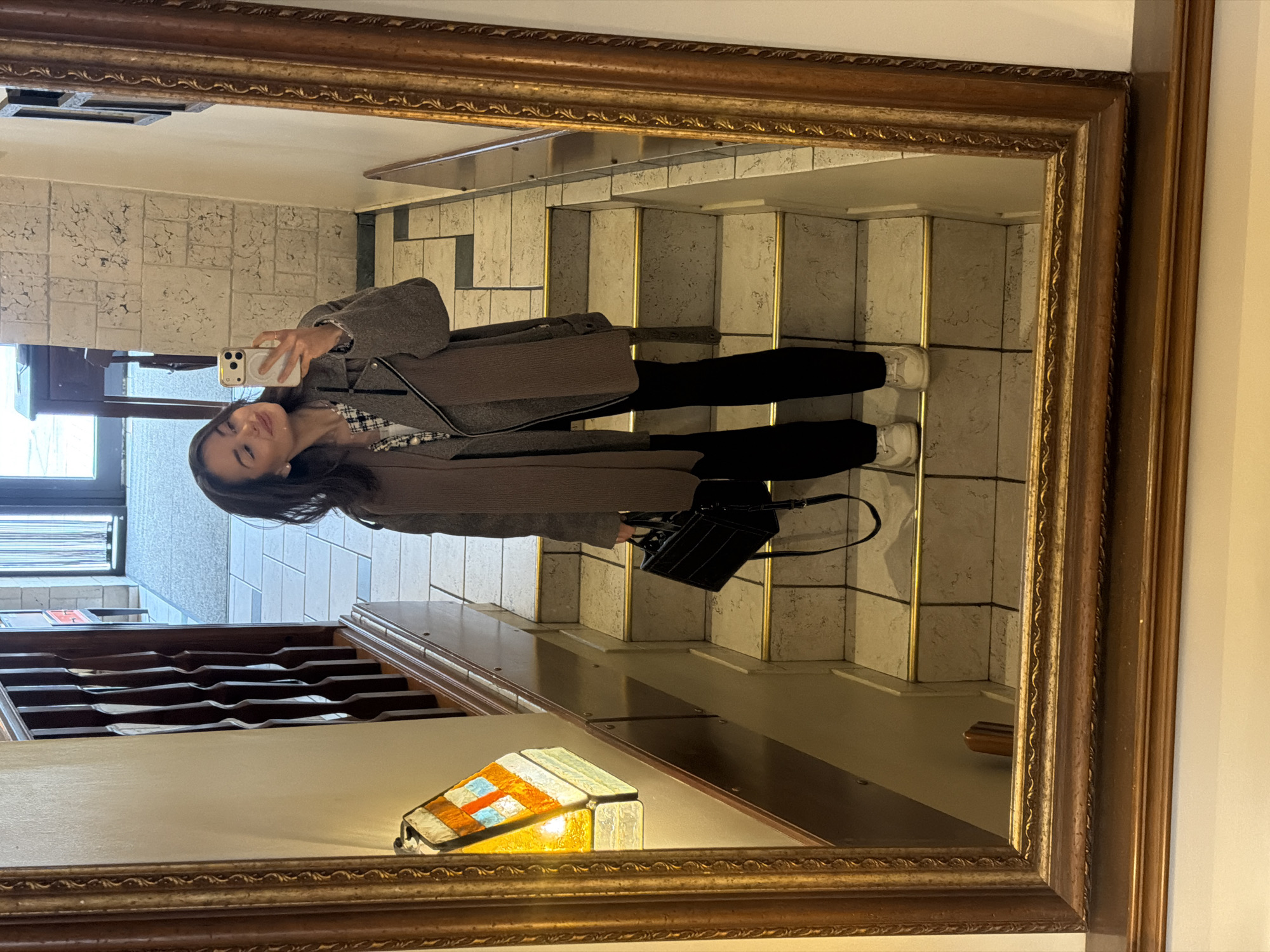 Woman captures selfie in gold mirror in Krasnoyarsk