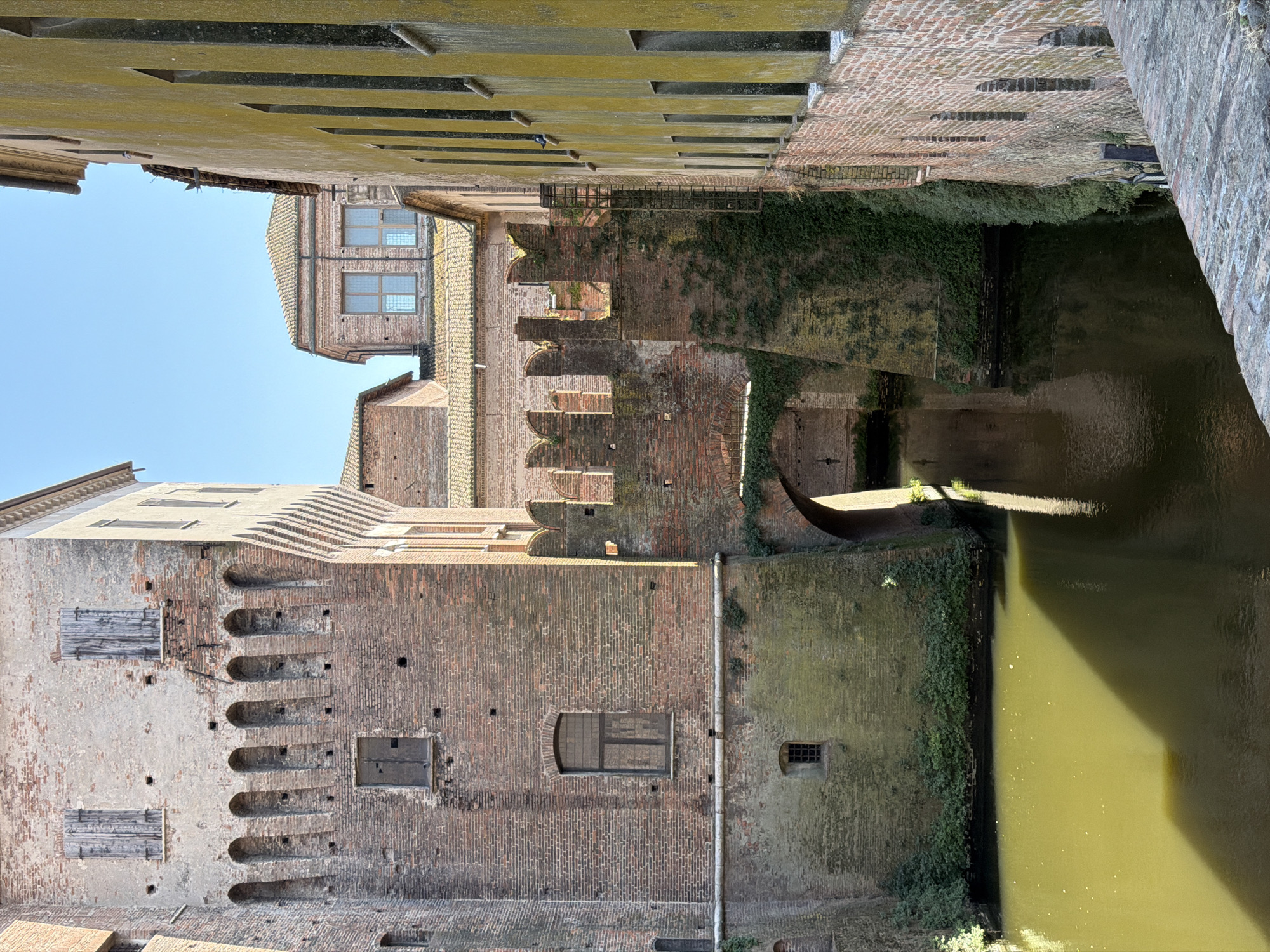 Tourist photographs medieval castle fortress in Mantua, Italy
