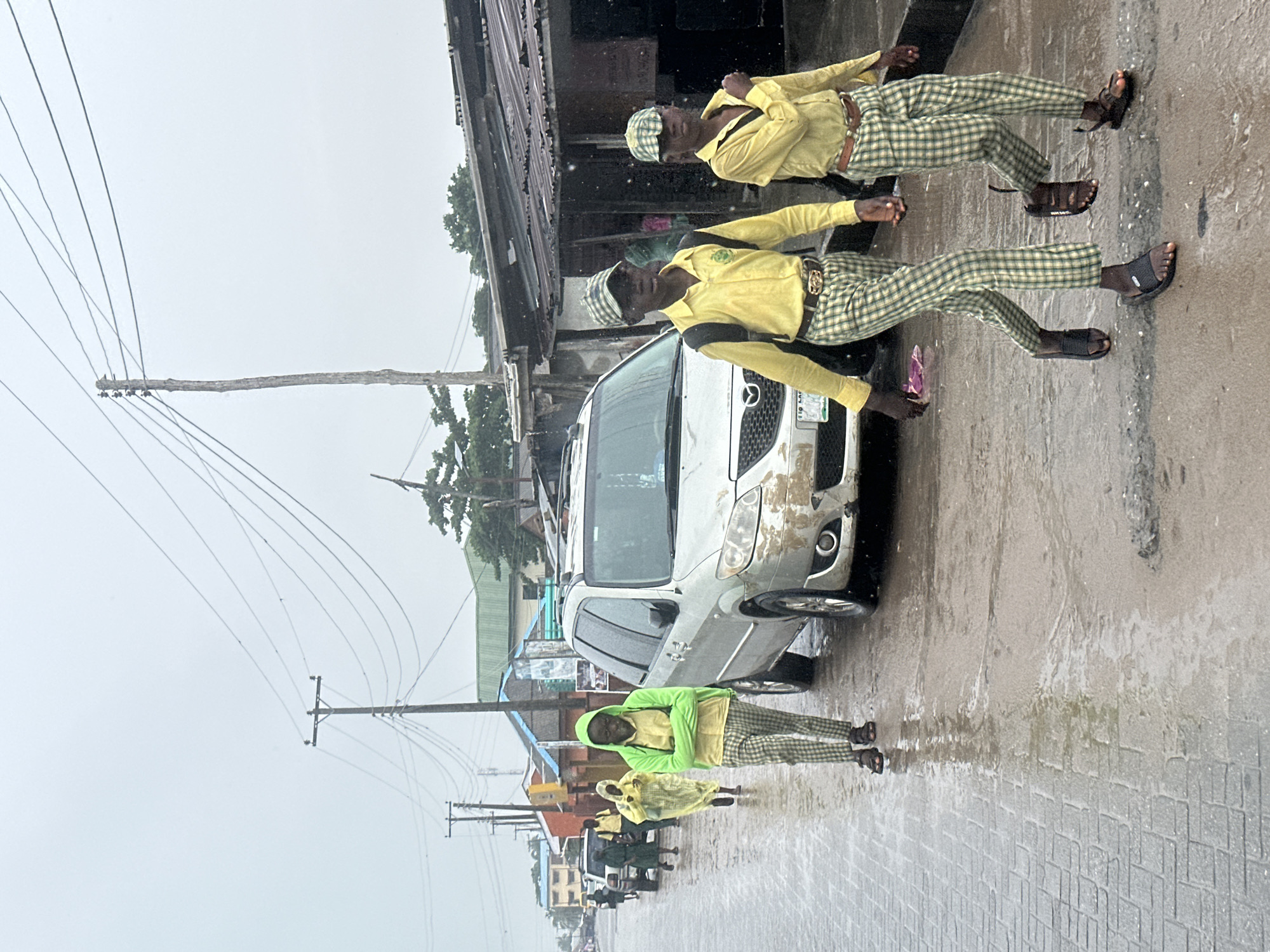 Rainy afternoon street activity in Badagry, Nigeria