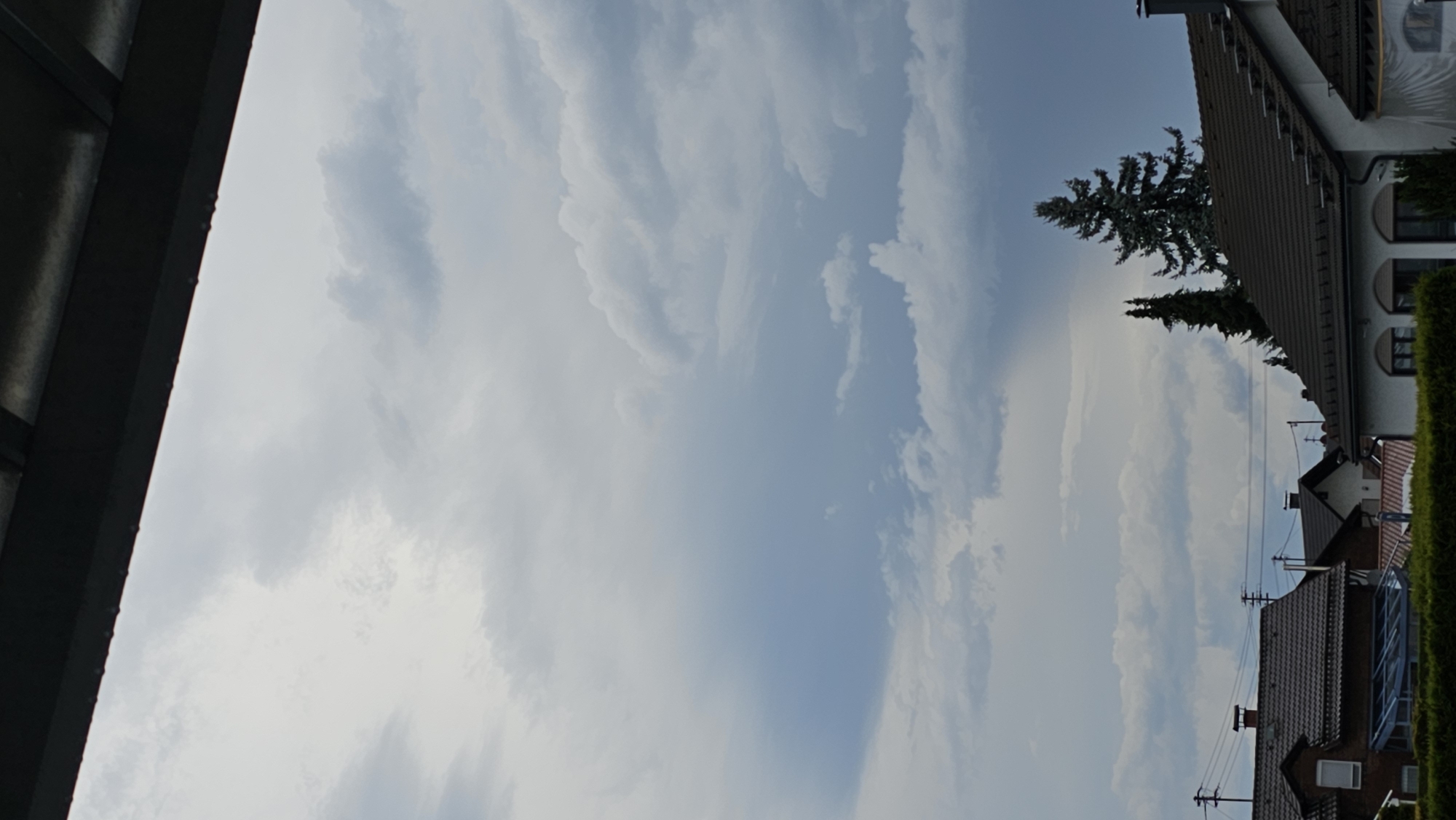 Heavy overcast skies over a Vöhringen neighborhood