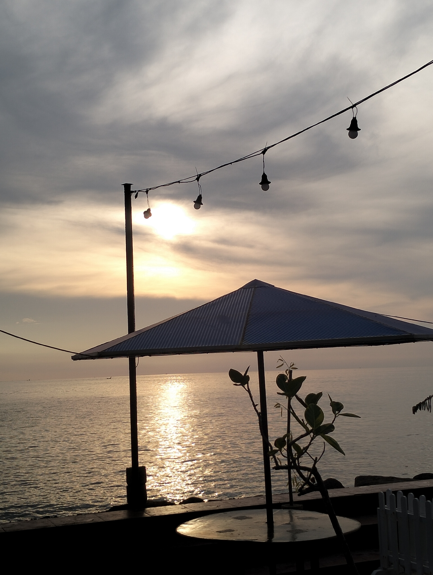 Evening coastal life documented in Lhokseumawe, Indonesia waterfront