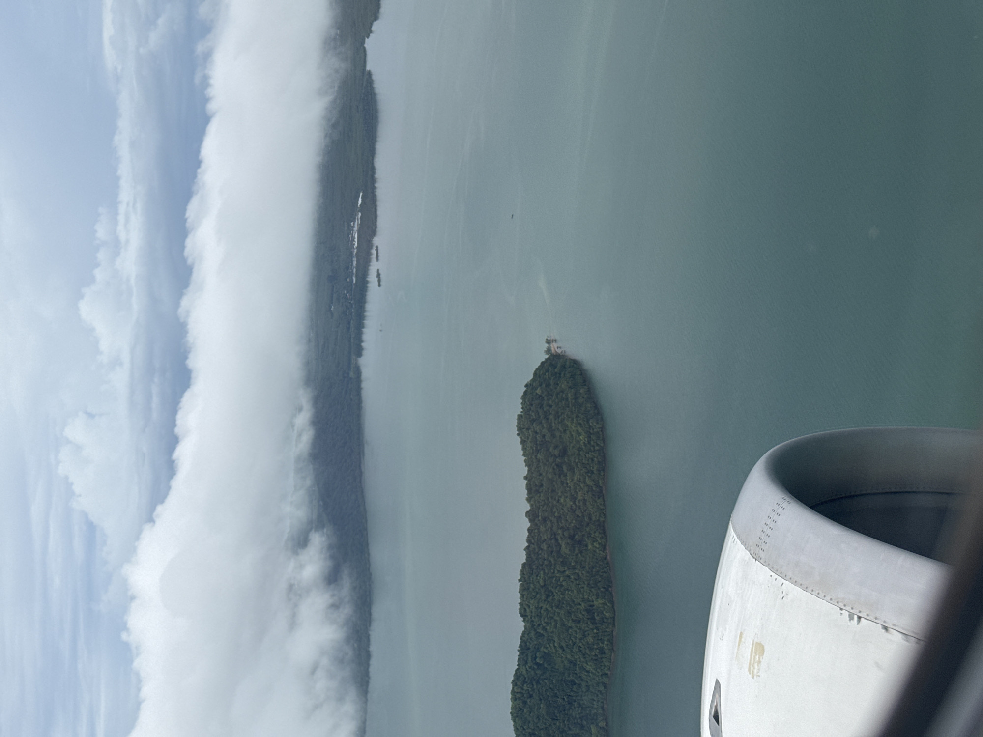 Aerial window view over a forested Thai island