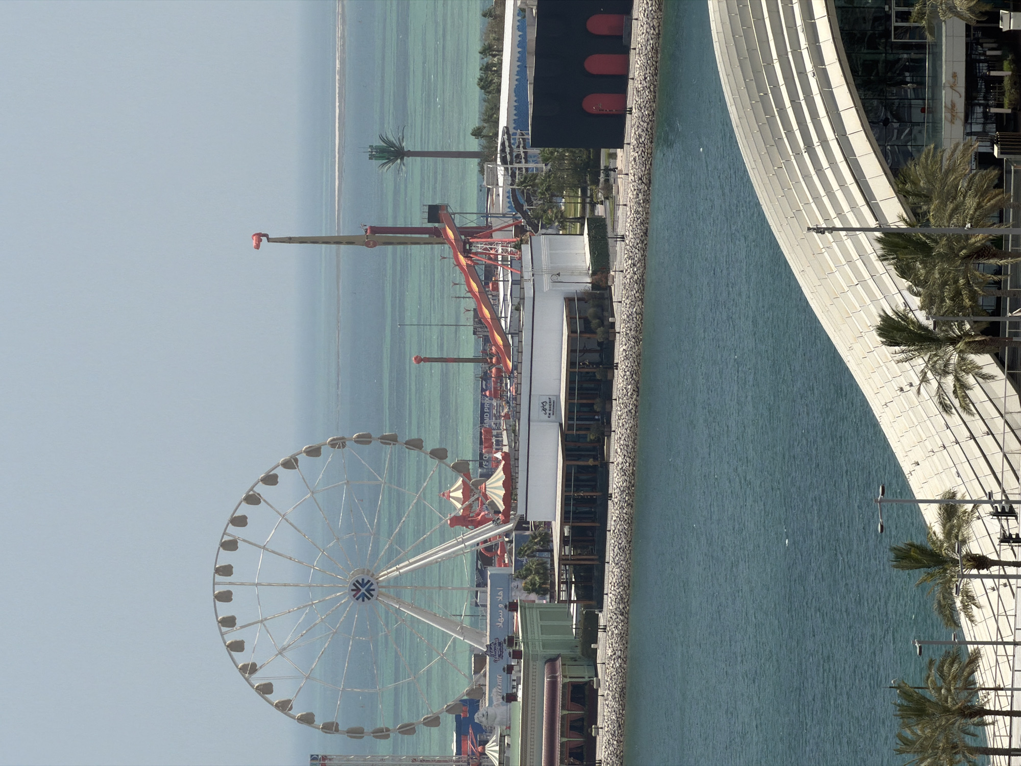 Coastal city with amusement park observed from multiple viewpoints