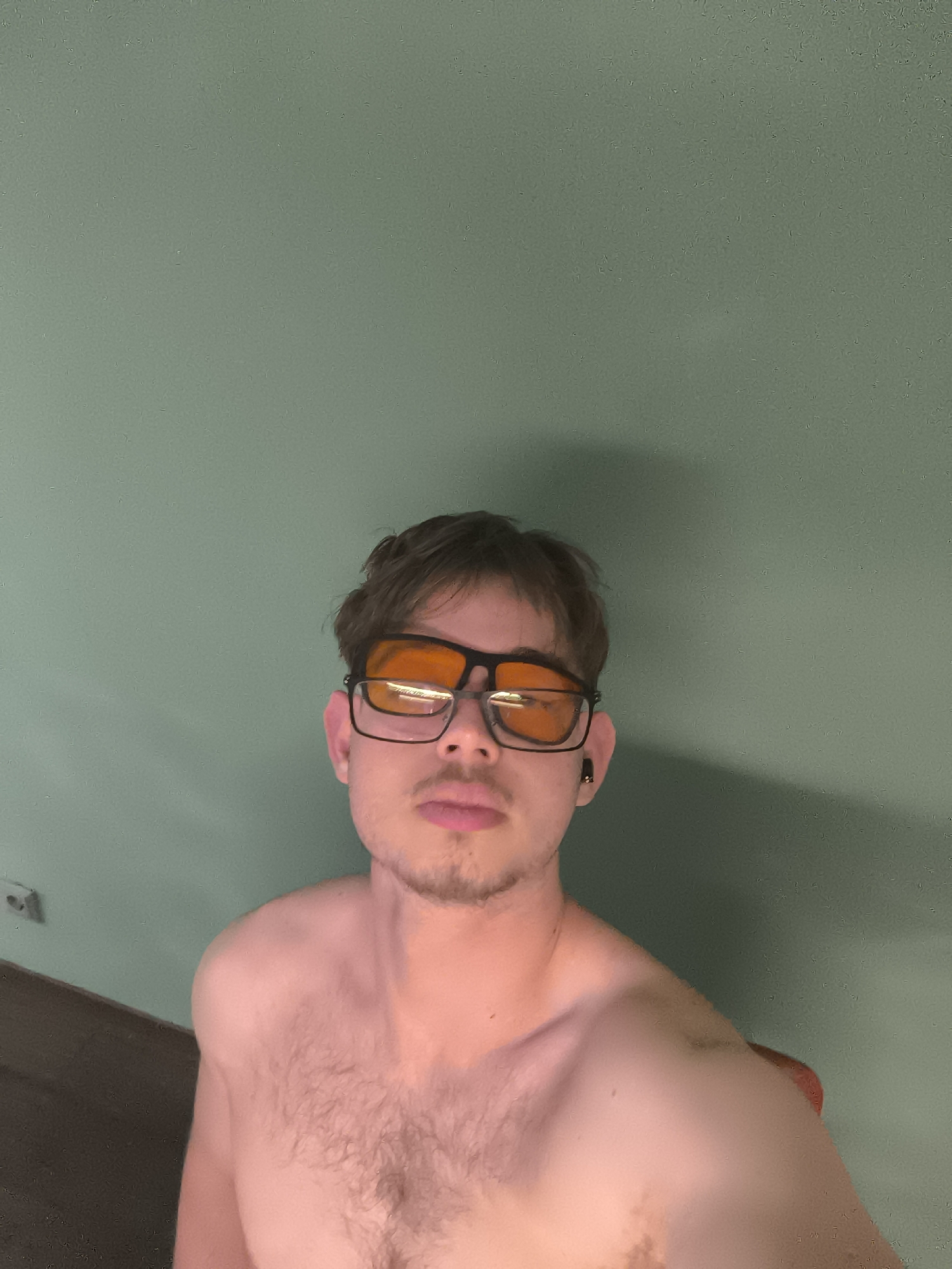 Young man photographed in multiple indoor portraits in Sofia